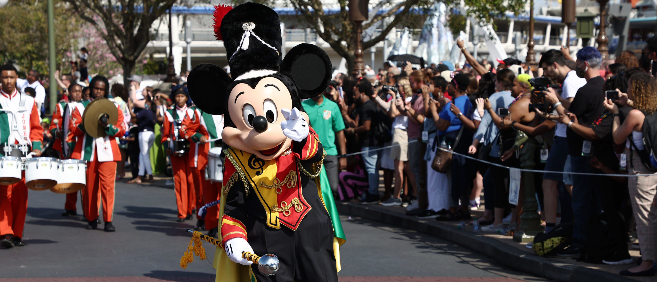 Mickey Mouse waves to fans during a parade at Walt Disney World Resort on March 03, 2022 in Lake Buena Vista, Florida. (Photo by Arturo Holmes/Getty Images for Disney Dreamers Academy)