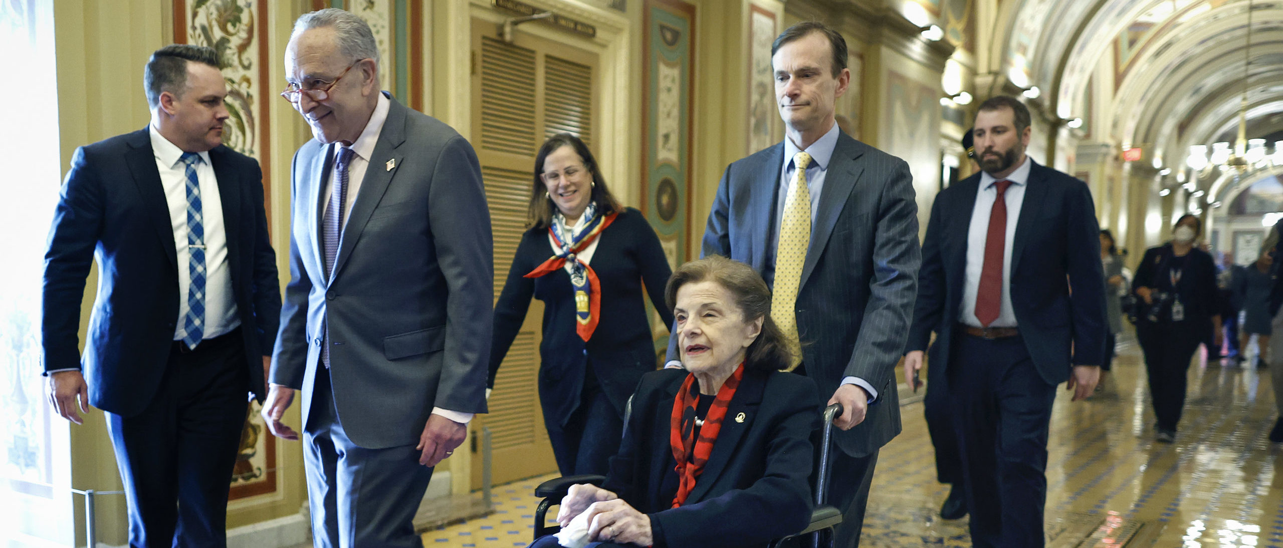 WASHINGTON, DC - MAY 10: U.S. Senate Majority Leader Charles Schumer (D-NY) escorts Sen. Dianne Feinstein (D-CA) as she arrives at the U.S. Capitol following a long absence due to health issues on May 10, 2023 in Washington, DC. Feinstein was fighting a case of shingles and has been absent from the Senate for almost three months. (Photo by Kevin Dietsch/Getty Images)