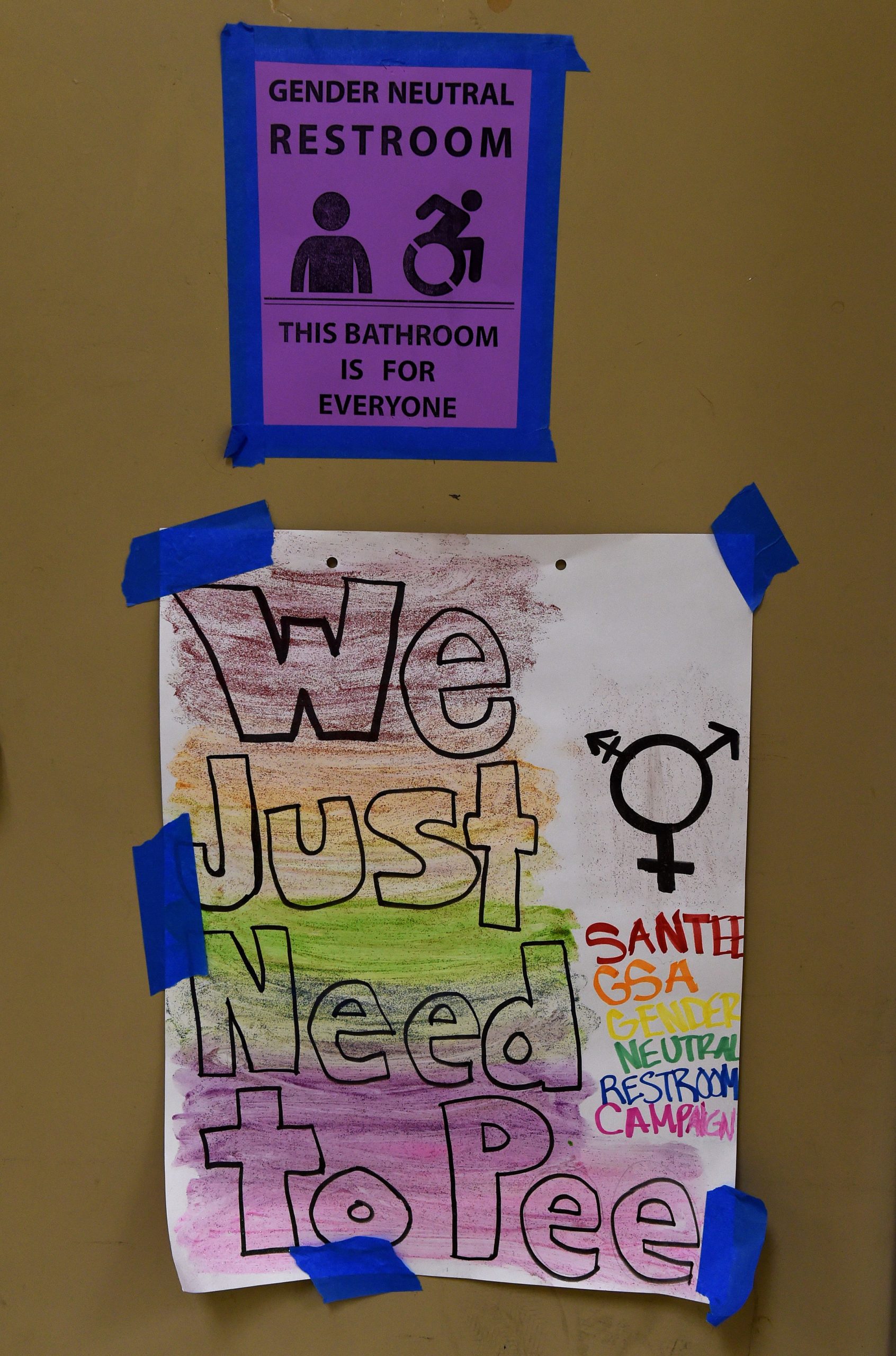 Signs are poseted outside the Santee High School's gender neutral restrooms at their campus in Los Angeles, California on May 4, 2016. There is an "emerging consensus worldwide" that the LGBT community should enjoy the same rights as everyone else, Washington's first envoy for gay rights said, but warned transgender people are still too often victims of violence. / AFP / Mark Ralston (Photo credit should read MARK RALSTON/AFP via Getty Images)