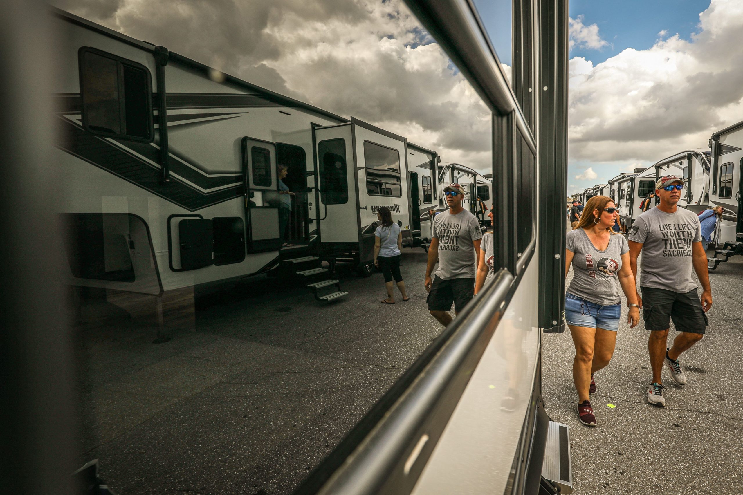 Visitors view recreational vehicles (RV), mobile homes, and motor homes during the West Palm Beach RV Show at the South Florida Fairgrounds in West Palm Beach, Florida, on February 19, 2023.(Photo by GIORGIO VIERA/AFP via Getty Images)