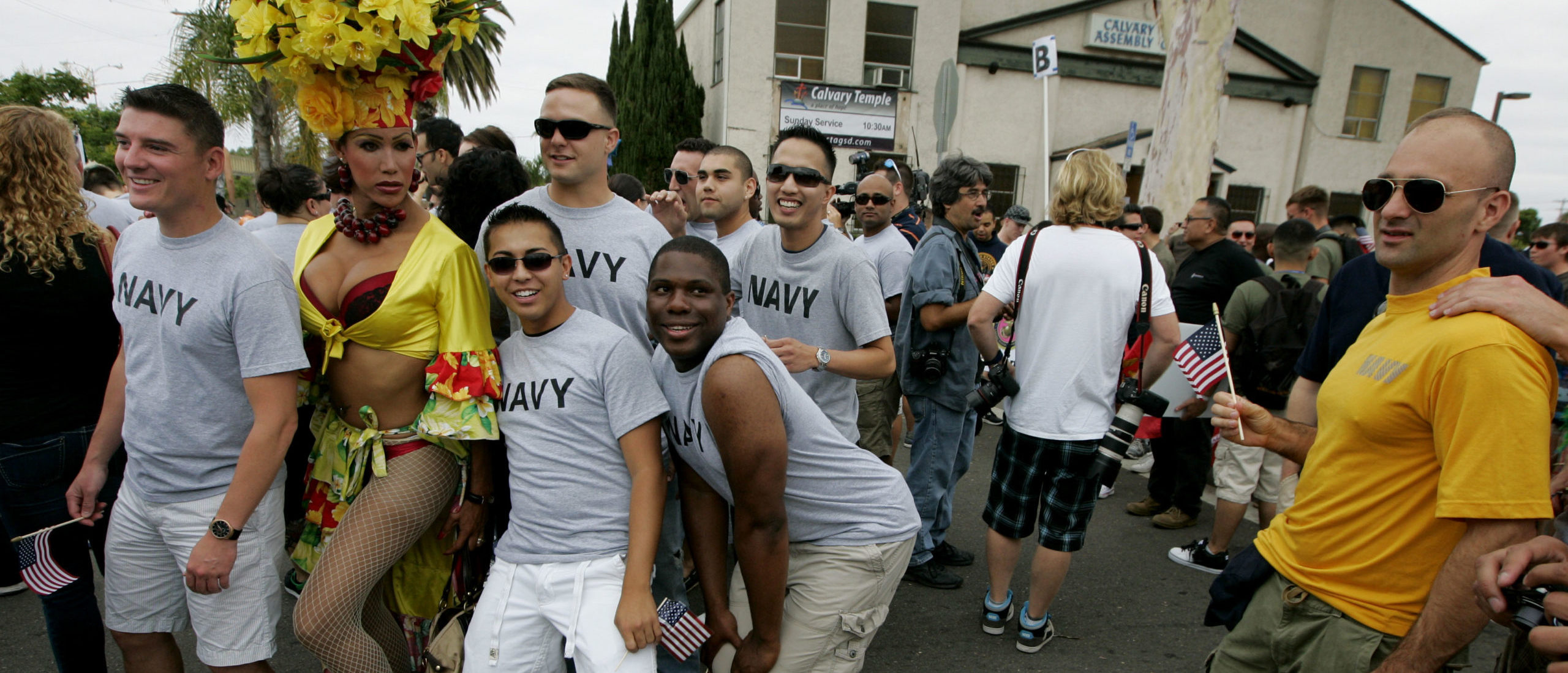 SAN DIEGO, CA - JULY 16: Navy personel pose for a picture with drag queen Bianca Sullivan before marching in the San Diego gay pride parade July 16, 2011 in San Diego, California. (Photo by Sandy Huffaker/Getty Images)
