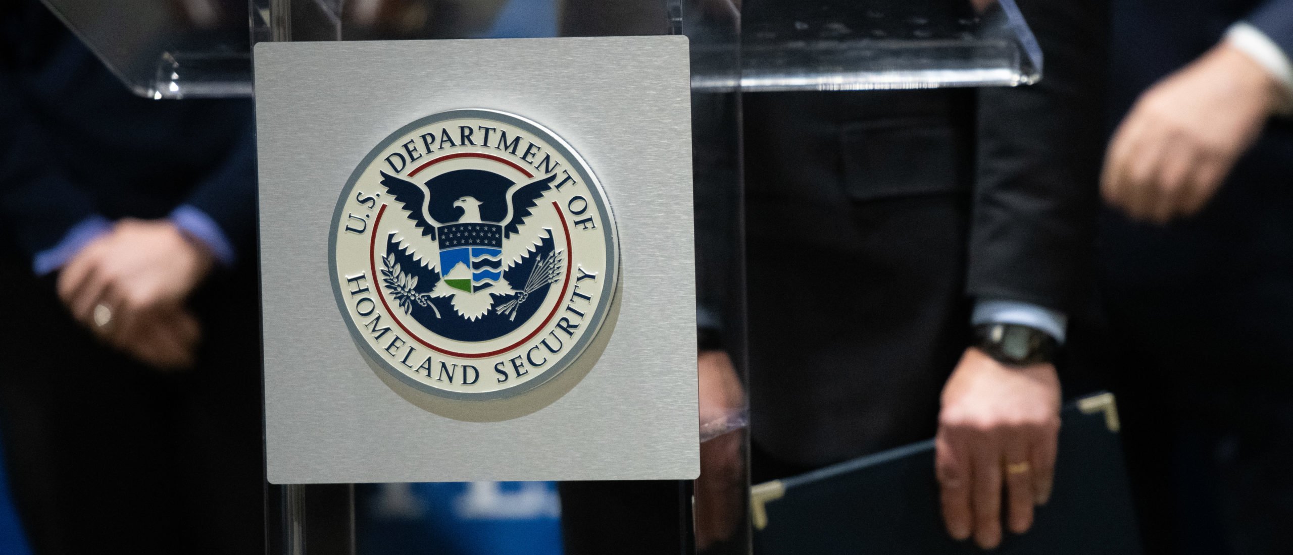 PHILADELPHIA, PA - MARCH 02: The U.S. Department of Homeland Security seal is seen as DHS Secretary Alejandro Mayorkas delivers remarks while visiting a FEMA community vaccination center on March 2, 2021 in Philadelphia, Pennsylvania. (Photo by Mark Makela/Getty Images)