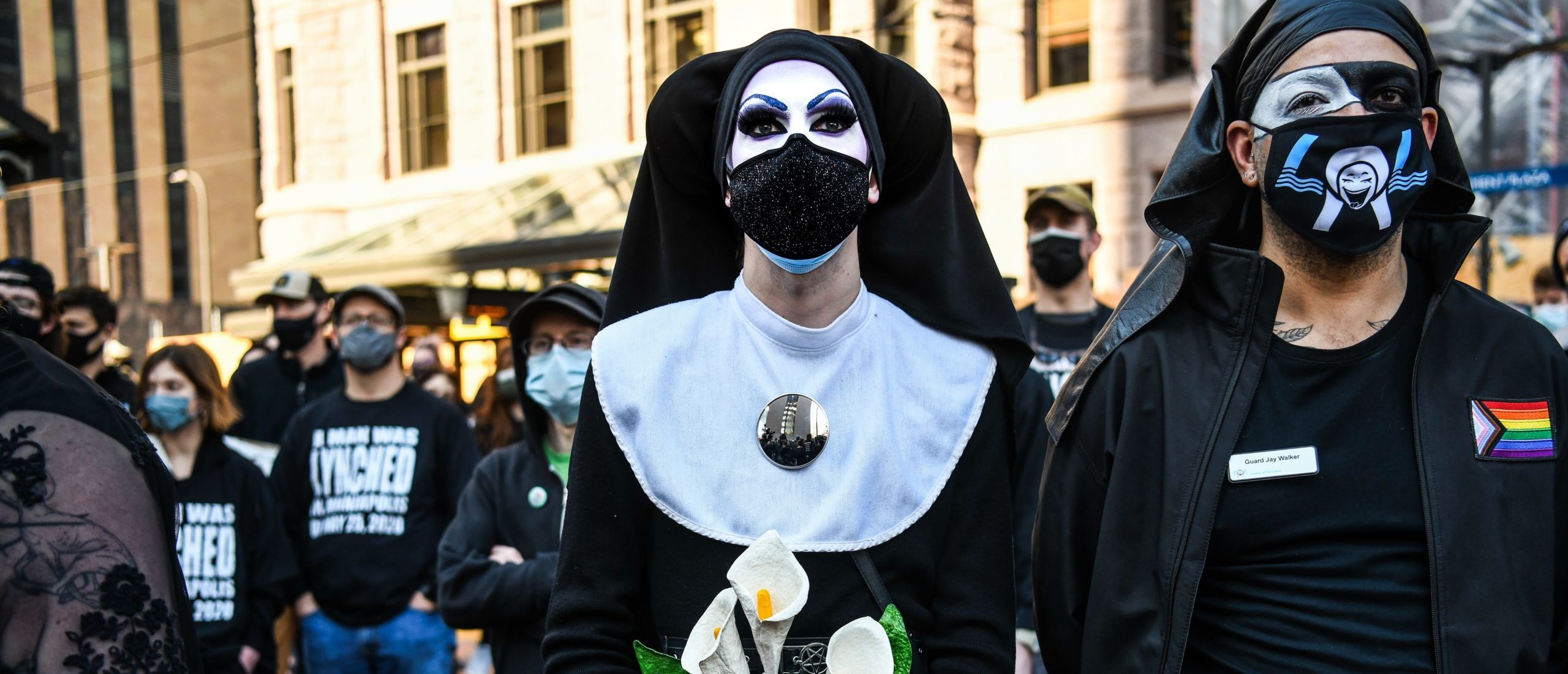 Members of Sisters of Perpetual Indulgence participate in the I Cant Breathe - Silent March for Justice in front of the Hennepin County Government Center on March 7, 2021, where the trial of former Minneapolis police officer Derek Chauvin, charged with murdering African American man George Floyd, will begin on March 8, 2021, in Minneapolis, Minnesota. (Photo by CHANDAN KHANNA/AFP via Getty Images)