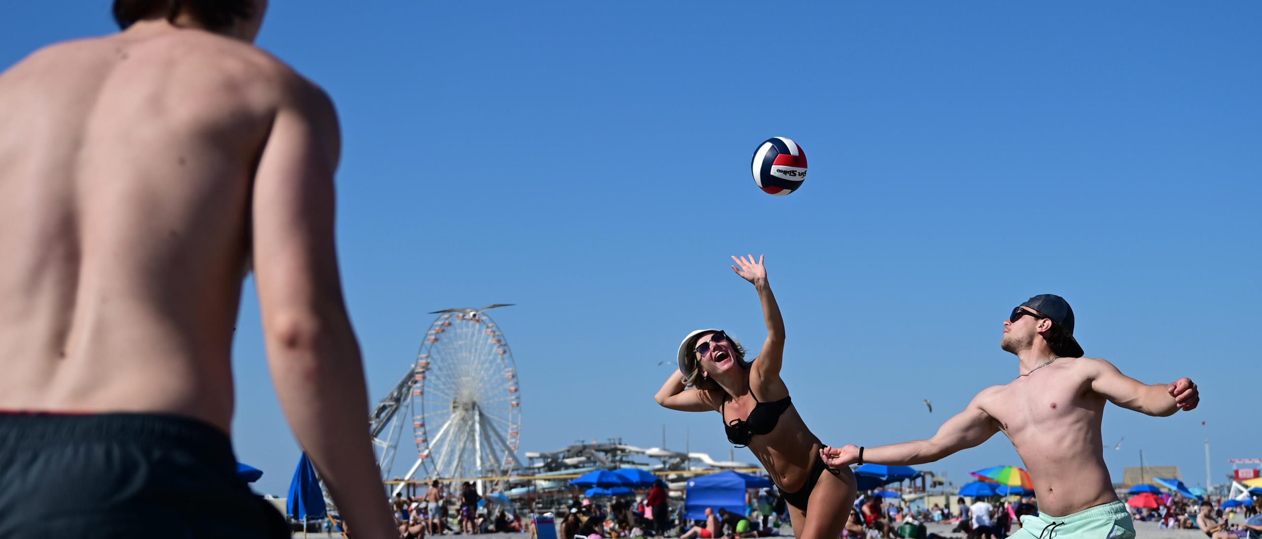 Young adults play volleyball on the beach on May 30, 2022 in Wildwood, New Jersey as part of Memorial Day events Image not from story. (Photo by Mark Makela/Getty Images)