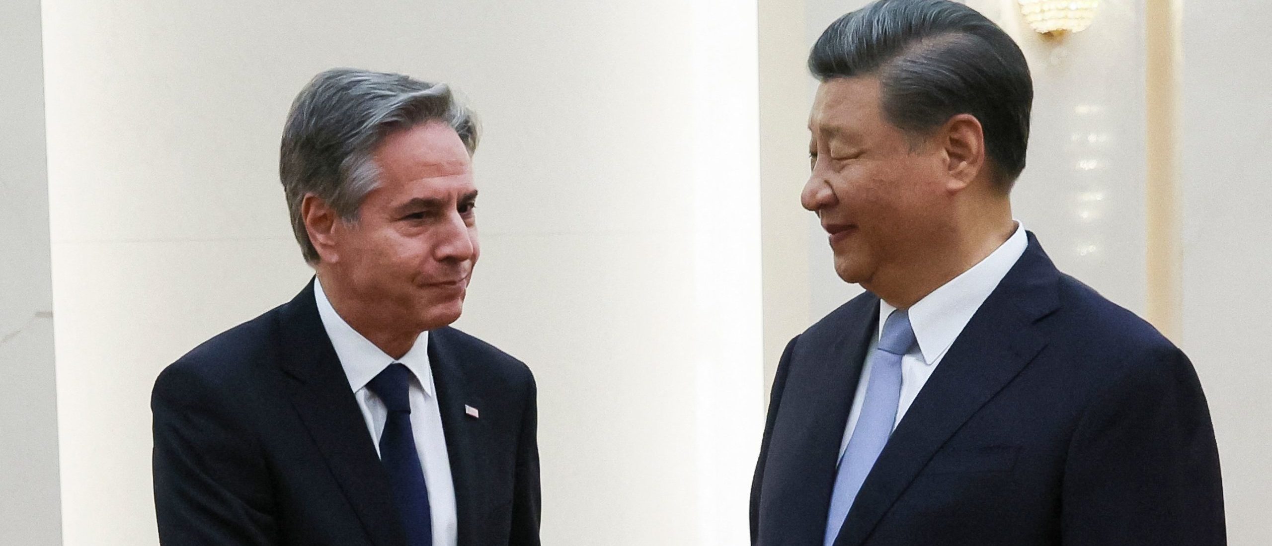 US Secretary of State Antony Blinken (L) shakes hands with China's President Xi Jinping at the Great Hall of the People in Beijing on June 19, 2023. (Photo by LEAH MILLIS/POOL/AFP via Getty Images)