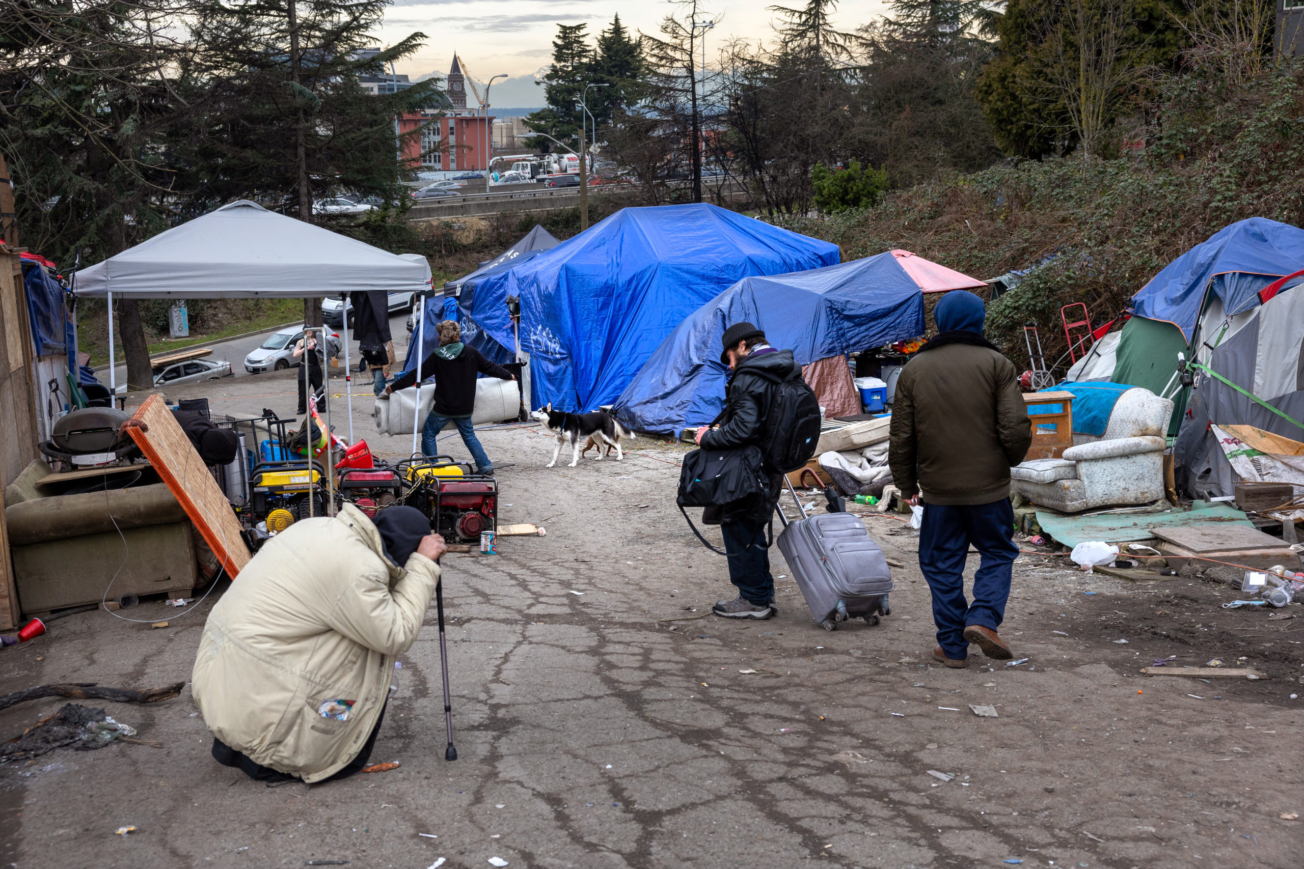 SEATTLE, WASHINGTON - MARCH 11: Residents of a homeless encampment walk through the encampment after smoking fentanyl on March 11, 2022 in Seattle, Washington. The city government is currently working to remove such encampments from shared spaces throughout Seattle. According to a recent report commissioned by Seattle Councilmember Andrew Lewis, the COVID-19 pandemic put undue pressure on the city's shelter system and delayed funds for new housing, leading to an increase in homelessness. (Photo by John Moore/Getty Images)