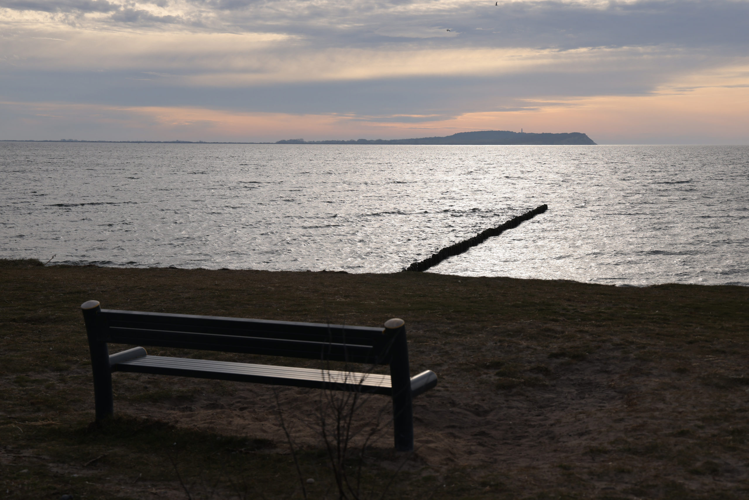 DRANSKE, GERMANY - MARCH 17: A bench looks out towards the Baltic Sea on Ruegen Island on March 17, 2023 near Dranske, Germany. According to media reports, German investigators suspect the Andromeda, a 50-foot Bavaria 50 Cruiser recreational sailing yacht, was used by a six-person crew to sail from Rostock with a stop over on Ruegen at nearby Wiek out to the Baltic Sea and plant explosives that detonated on the Nord Stream pipeline in September of 2022, causing extensive damage. Investigators reportedly found traces of explosives on the table inside the yacht. While initial findings point to a possible Ukrainian connection to the sabotage operation, many questions remain open. The Andromeda is currently in dry dock on the nearby headland of Bug. 