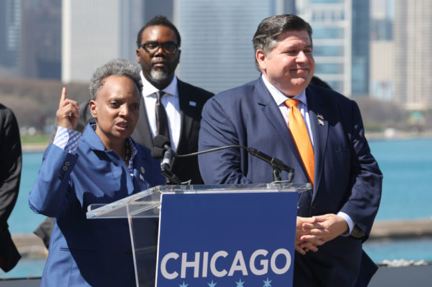 CHICAGO, ILLINOIS - APRIL 12: Mayor Lori Lightfoot (L) speaks to business and political leaders including Mayor-elect Brandon Johnson (C) and Illinois Governor J.B. Pritzker during an event to officially announce Chicago as the host city for the 2024 Democratic National Convention on April 12, 2023 in Chicago, Illinois. Chicago last hosted the convention in 1996. (Photo by Scott Olson/Getty Images)
