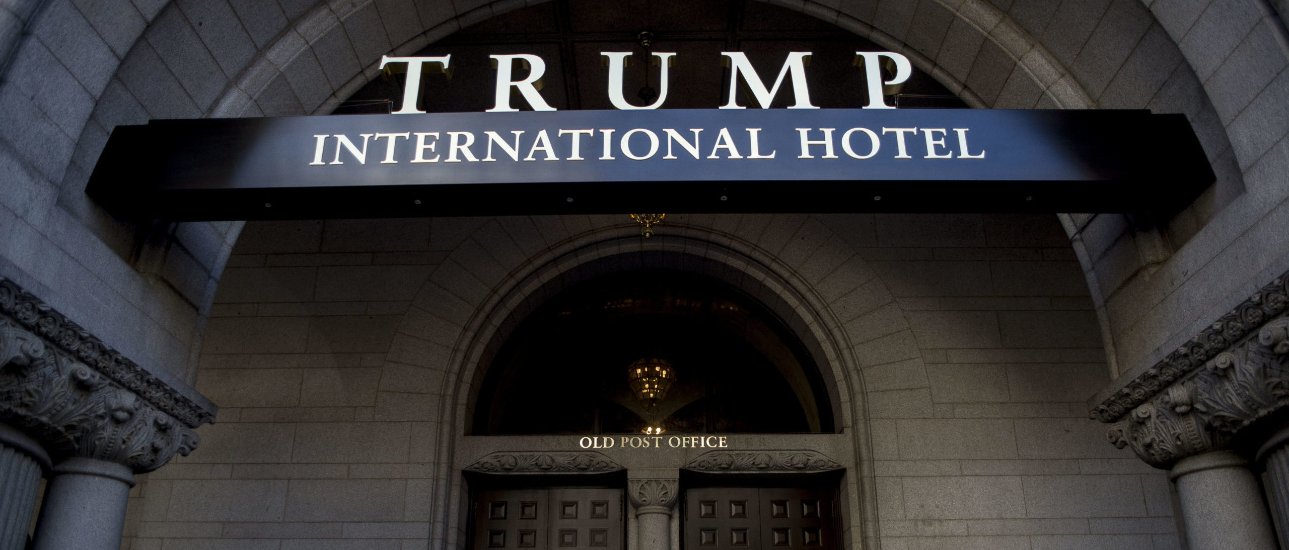 Anti-Trump Activists Protest Outside Of Trump International Hotel Opening Ceremony