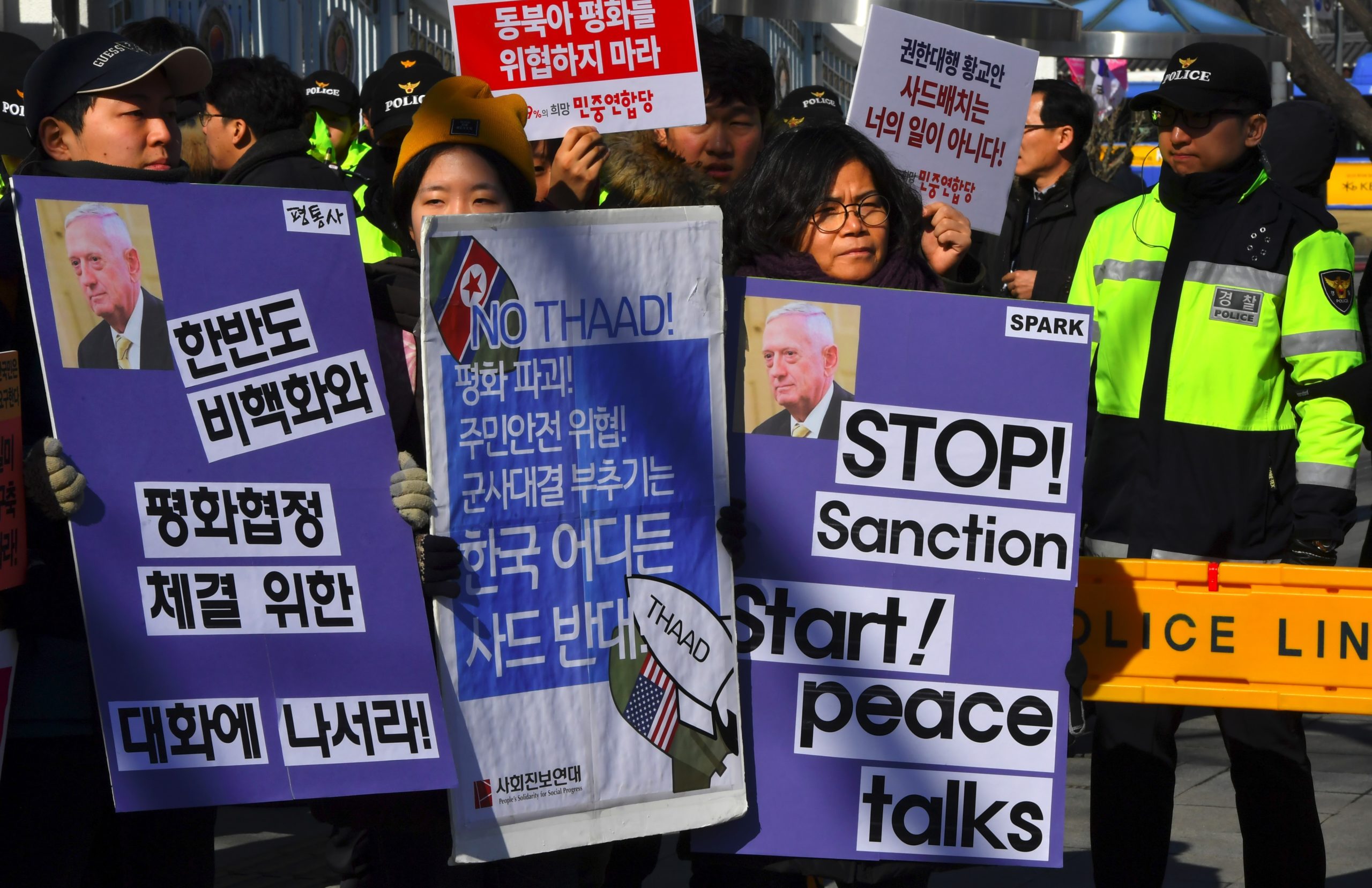 South Korean anti-war activists hold placards during a rally against the visit of the US Defense Secretary James Mattis in Seoul on February 2, 2017 as they denounce the planned deployment of the US-built Terminal High Altitude Area Defense, THAAD. Mattis will meet with South Korean Defense Minister Han Min-Koo and other senior officials as the meetings are expected to focus on ways to cope with North Korean threats and further strengthen the alliance.
