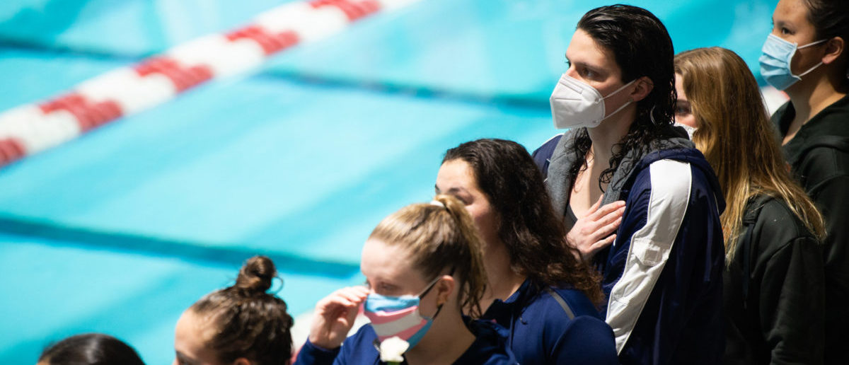 University of Pennsylvania swimmer Lia Thomas places her hand over her heart during the playing of the National Anthem at the 2022 Ivy League Womens Swimming and Diving Championships at Blodgett Pool. (Photo by Kathryn Riley/Getty Images)