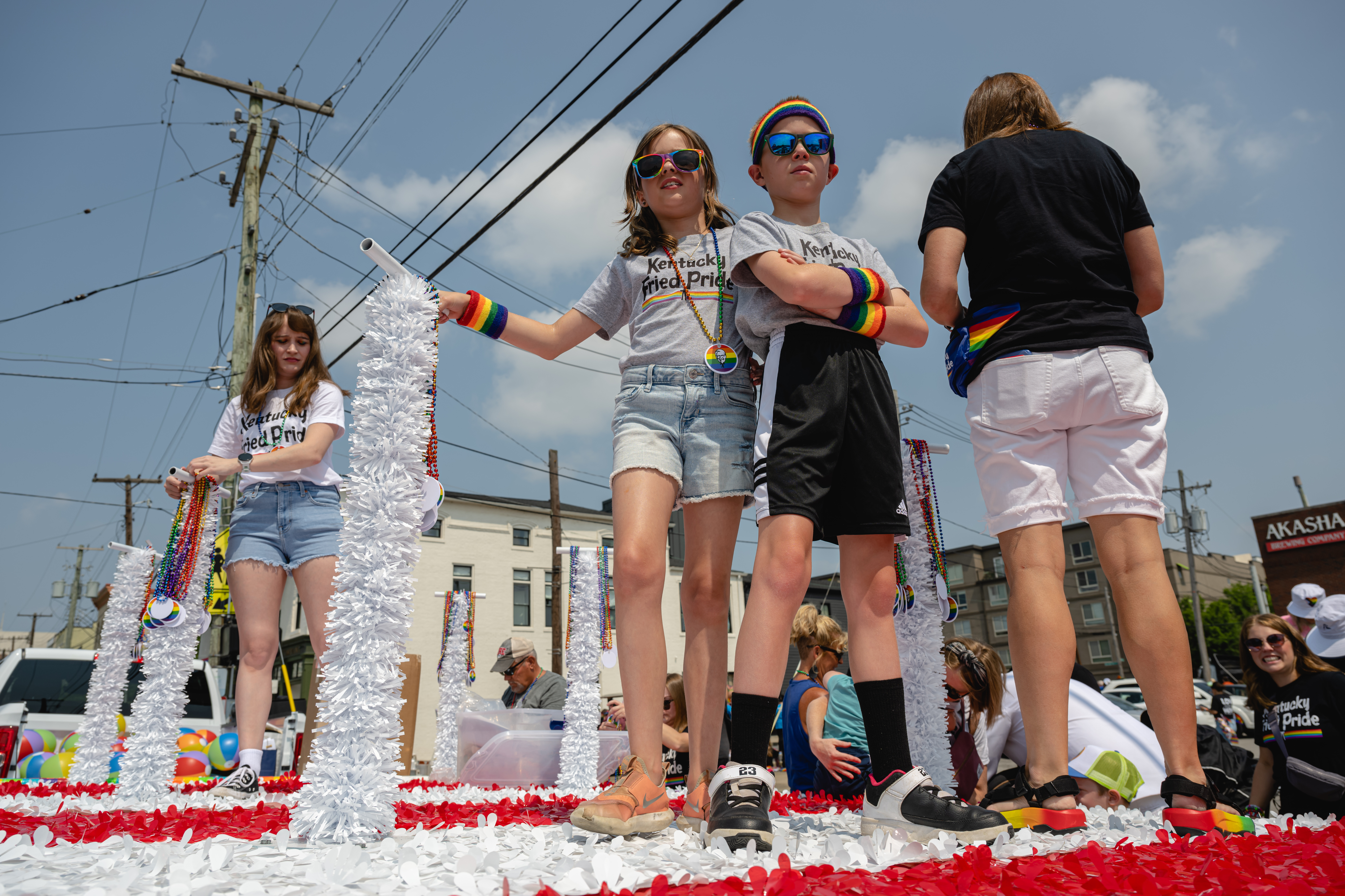 LOUISVILLE, KENTUCKY - JUNE 17: Children stand on top of a Kentucky Fried Chicken float of the Kentuckiana Pride Parade on June 17, 2023 in Louisville, Kentucky. According to the American Civil Liberties Union, nearly 500 anti-LGBTQ+ bills have been introduced across the U.S. in state legislatures since the beginning of 2023. (Photo by Jon Cherry/Getty Images)