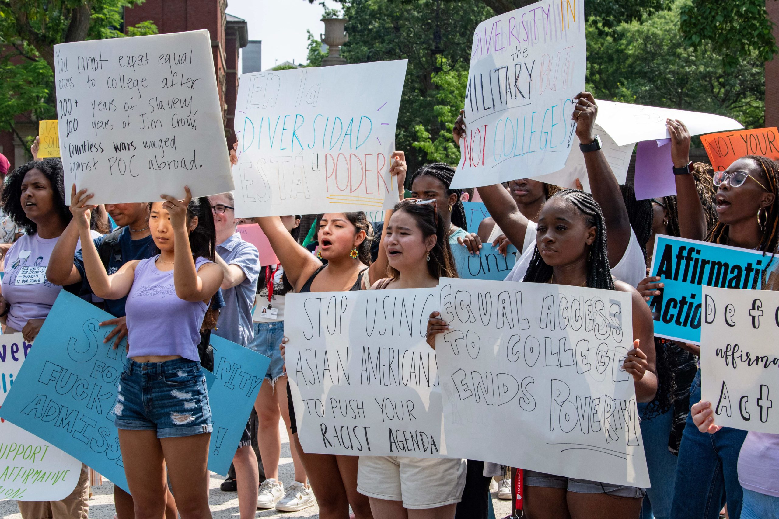 Proponents of affirmative action hold signs during a protest at Harvard University in Cambridge, Massachusetts, on July 1, 2023. The US Supreme Court on June 27 banned the use of race and ethnicity in university admissions, dealing a major blow to a decades-old practice that boosted educational opportunities for African-Americans and other minorities. (Photo by Joseph Prezioso / AFP) (Photo by JOSEPH PREZIOSO/AFP via Getty Images)