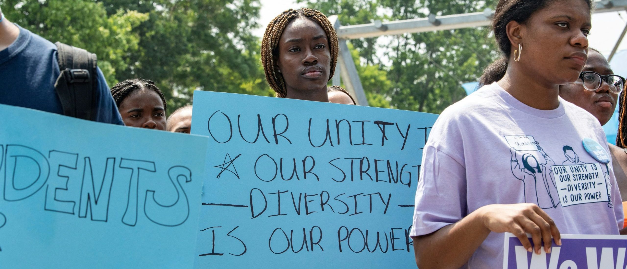 Proponents of affirmative action hold signs during a protest at Harvard University in Cambridge, Massachusetts, on July 1, 2023. The US Supreme Court on June 27 banned the use of race and ethnicity in university admissions, dealing a major blow to a decades-old practice that boosted educational opportunities for African-Americans and other minorities. (Photo by Joseph Prezioso / AFP) (Photo by JOSEPH PREZIOSO/AFP via Getty Images)