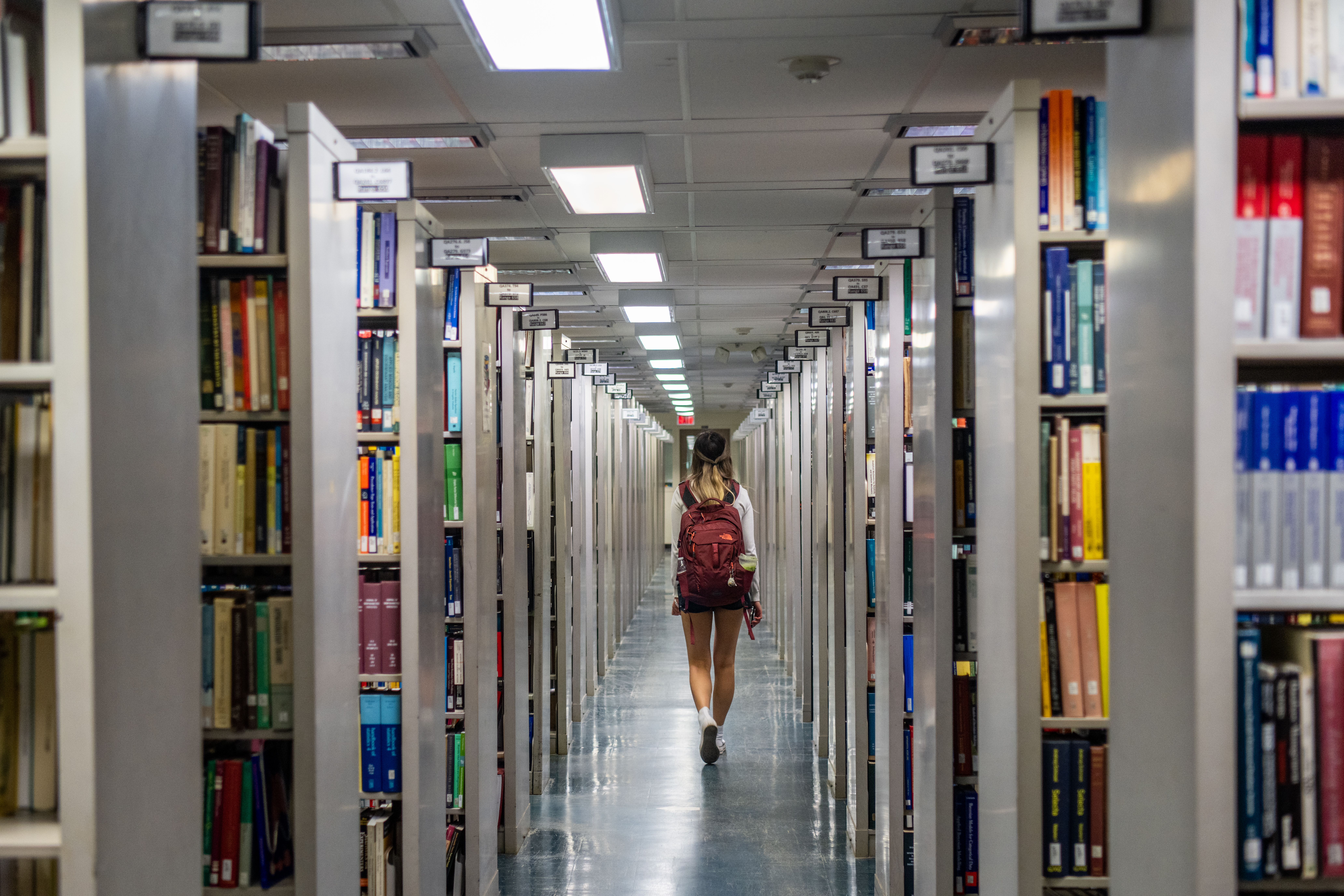 A person walks through the Rice University Library on April 26, 2022 in Houston, Texas. A group of local residents are suing Llano County in federal court for the County's removal and censorship of library books addressing racism and LGBTQ issues. The lawsuit addresses "censorship of public libraries being a violation of the first and fourteenth amendments" and comes as conservatives continue to seek and implement restrictions on children's content covering American history, racism, and LGBTQ issues. (Photo by Brandon Bell/Getty Images)