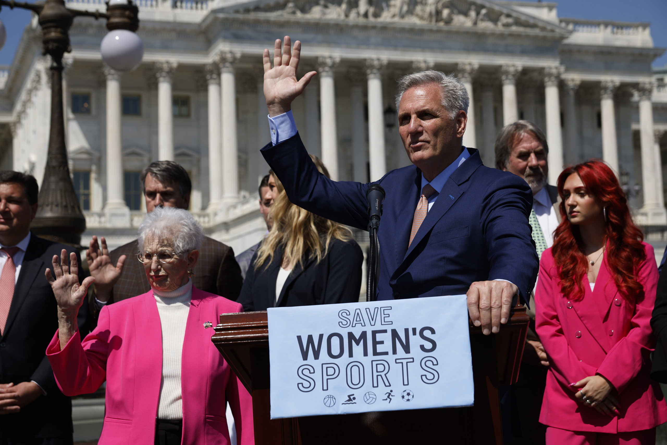 Speaker of the House Kevin McCarthy (R-CA) (C) and Rep. Virginia Foxx (R-VA) (L) raise their hands when asked if they know a transgender woman during an event to celebrate the House passing The Protection Of Women And Girls In Sports Act outside the U.S. Capitol on April 20, 2023 in Washington, DC. President Joe Biden has promised to veto the legislation, which defines sex as 'based solely on a person’s reproductive biology and genetics at birth' and would ban all transgender women and girls from competing in female school sports. (Photo by Chip Somodevilla/Getty Images)