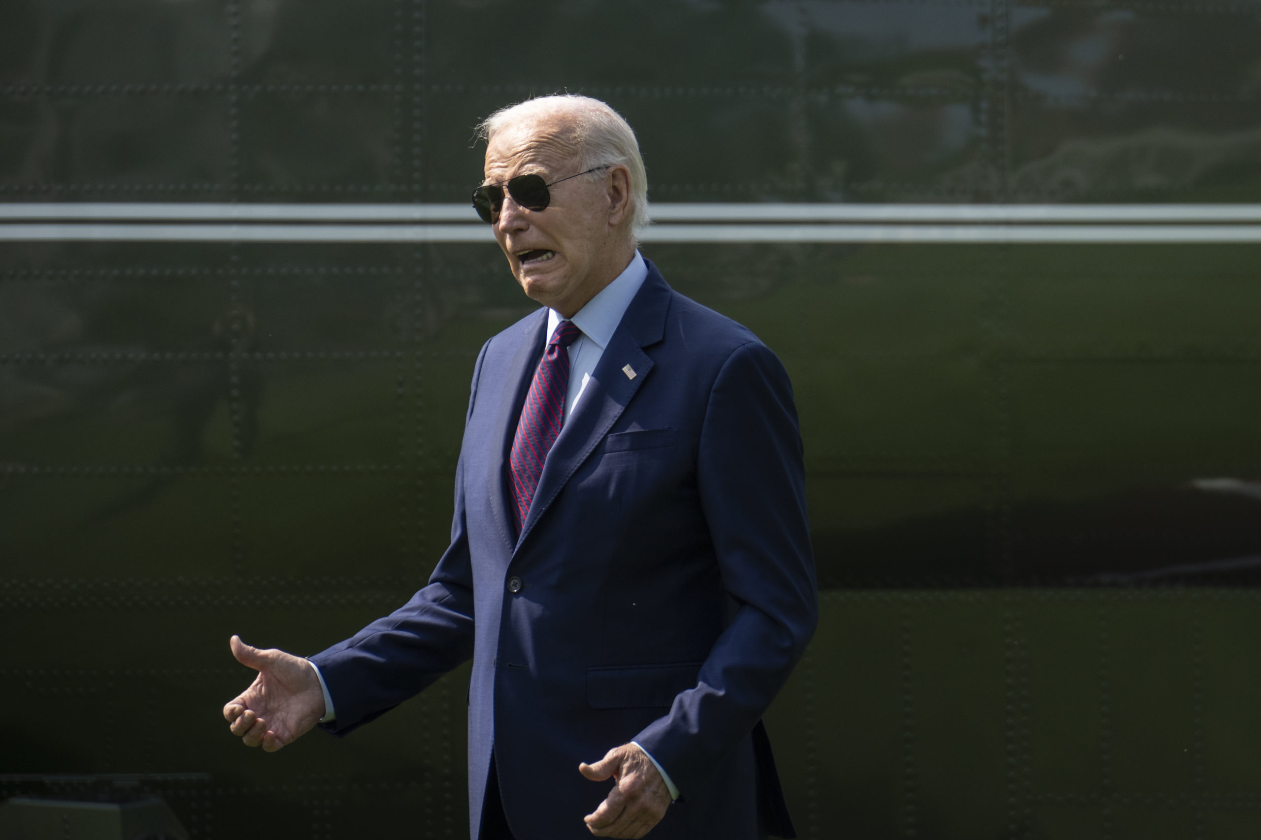 WASHINGTON, DC - JULY 28: U.S. President Joe Biden gestures toward visitors watching the departure as he walks to Marine One on the South Lawn of the White House July 28, 2023 in Washington, DC. President Biden is traveling to Auburn, Maine to discuss manufacturing and his "Bidenomics" economic plan. (Photo by Drew Angerer/Getty Images)