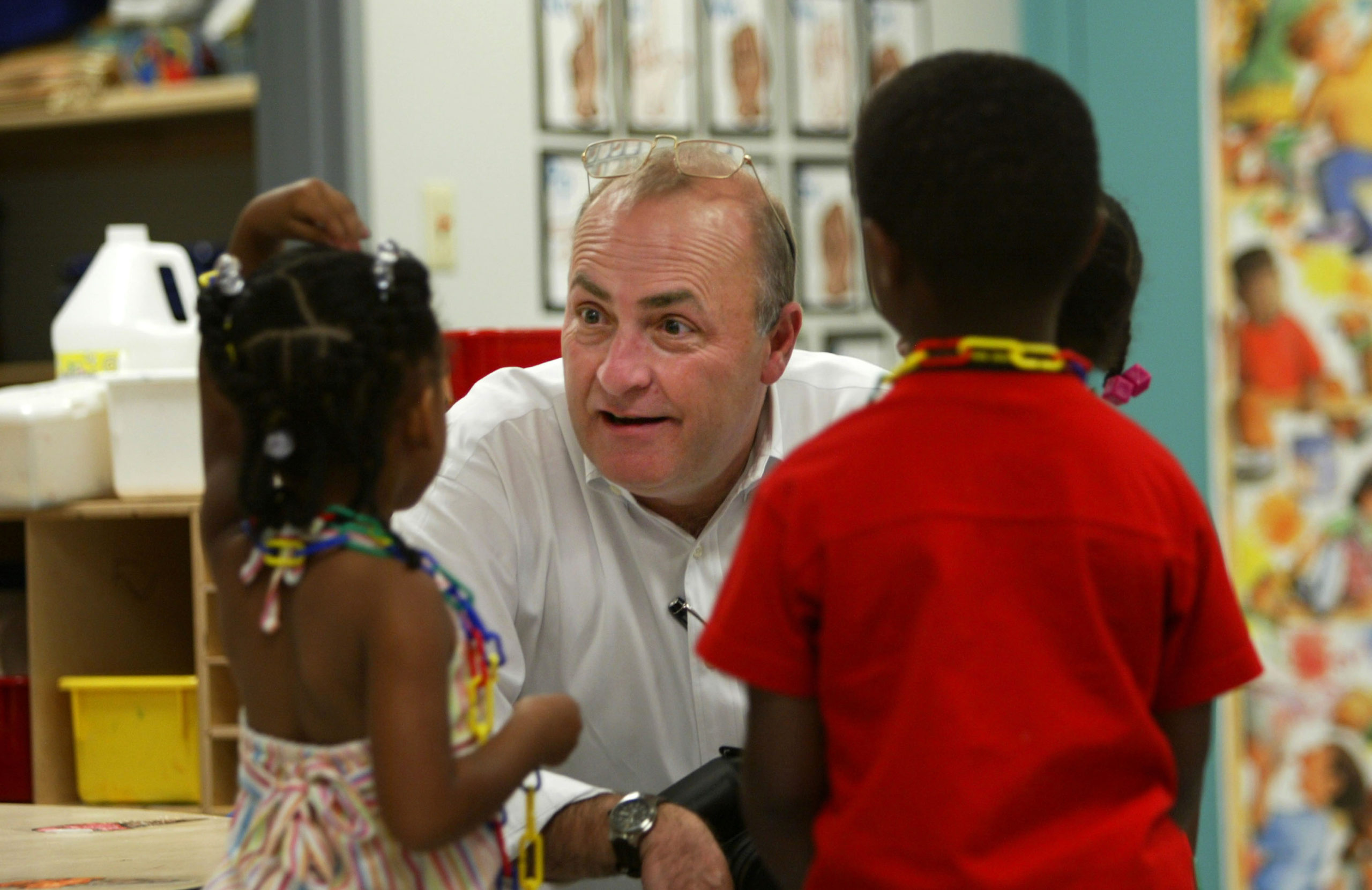 Robert Grom, president of Heritage Health Foundation, chats with children at the 4 Kids Early Learning Center August 24, 2004 in Braddock, Pennsylvania. The center is funded mostly by The Heinz Endowments. The average family income of children at the center is about $13,000 a year. The H.J. Heinz Co., based in Pittsburgh, once was one of the former industrial center's major employers. Now, Heinz's manufacturing has gone global and the impact on Pittsburgh is less. The Heinz family and its namesake foundation are no longer tied to the company, but their influence lives on, through philanthropy and the involvement of John Kerry's wife, Teresa Heinz Kerry, the widow of the late U.S. Senator H. John Heinz III. (Photo by Chris Hondros/Getty Images)