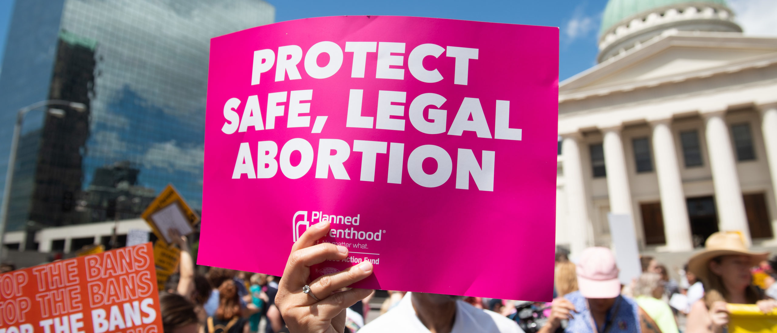 Protesters hold signs as they rally in support of Planned Parenthood and pro-choice and to protest a state decision that would effectively halt abortions by revoking the center's license to perform the procedure, near the Old Courthouse in St. Louis, Missouri, May 30, 2019. (Photo by SAUL LOEB / AFP via Getty Images)