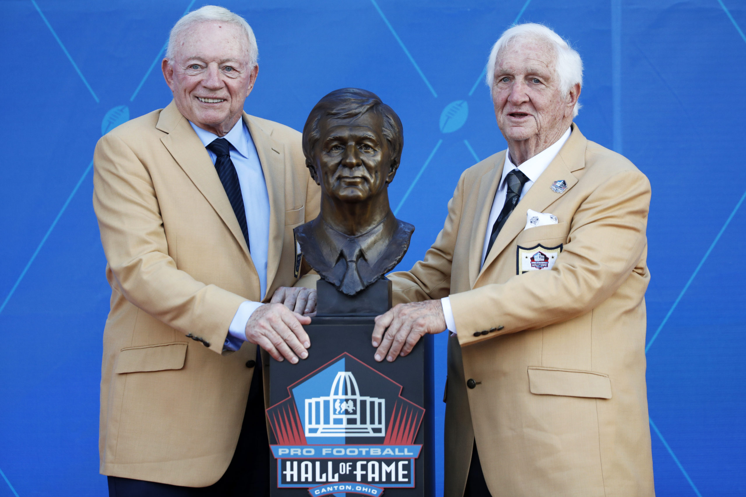 CANTON, OH - AUGUST 03: Gil Brandt with presenter and Dallas Cowboys owner Jerry Jones during Brandt's enshrinement in the Pro Football Hall of Fame at Tom Benson Hall Of Fame Stadium on August 3, 2019 in Canton, Ohio. (Photo by Joe Robbins/Getty Images)