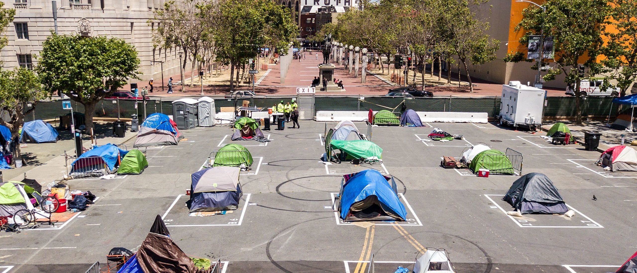Rectangles are painted on the ground to encourage homeless people to keep social distancing at a city-sanctioned homeless encampment across from City Hall in San Francisco, California, on May 22, 2020.