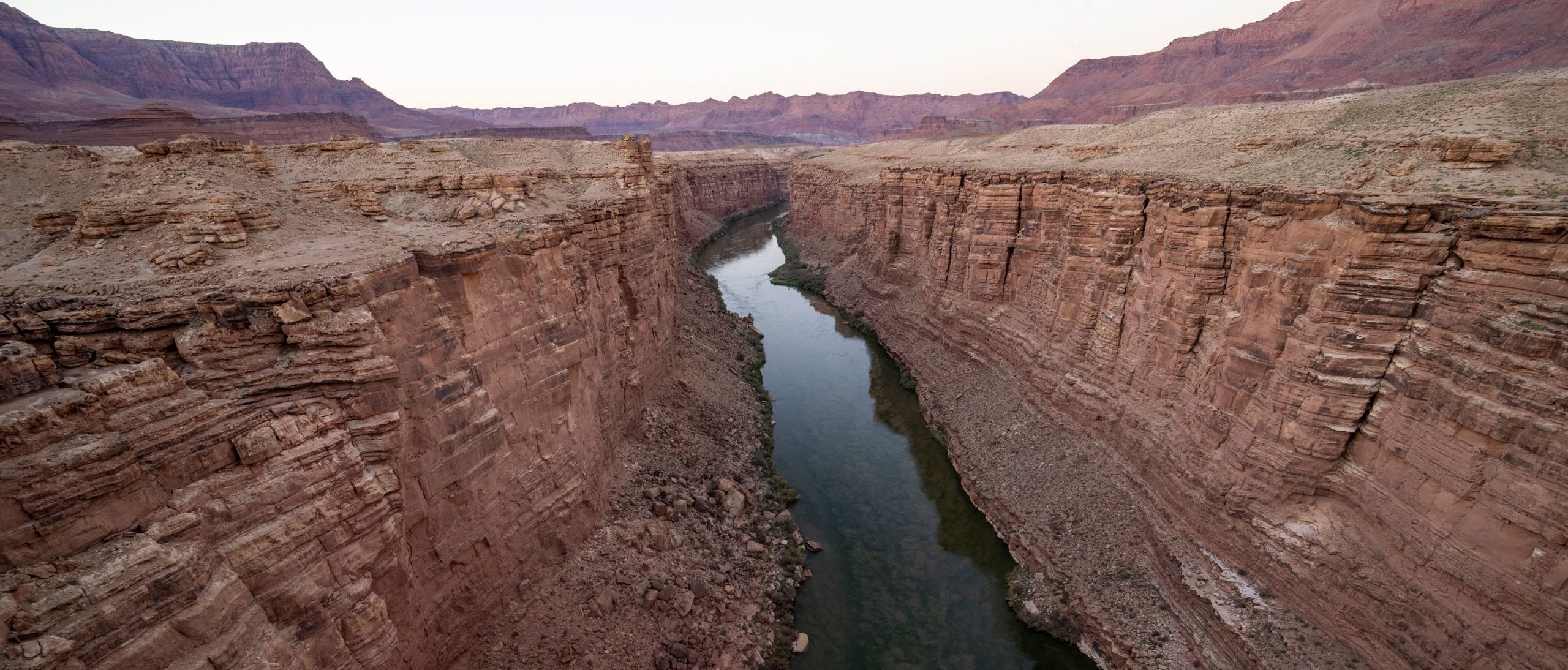 A view of the Colorado River from the Navajo Bridge in Marble Canyon, Arizona, August 31, 2022. - Amidst the drought and water shortages plaguing the country, last month the US government declared a water shortage on the Colorado River for the first time, triggering mandatory water consumption cuts for states in the Southwest, as climate change-fueled drought pushes the level in Lake Powell and Lake Mead to unprecedented lows. (Photo by Robyn Beck / AFP) 