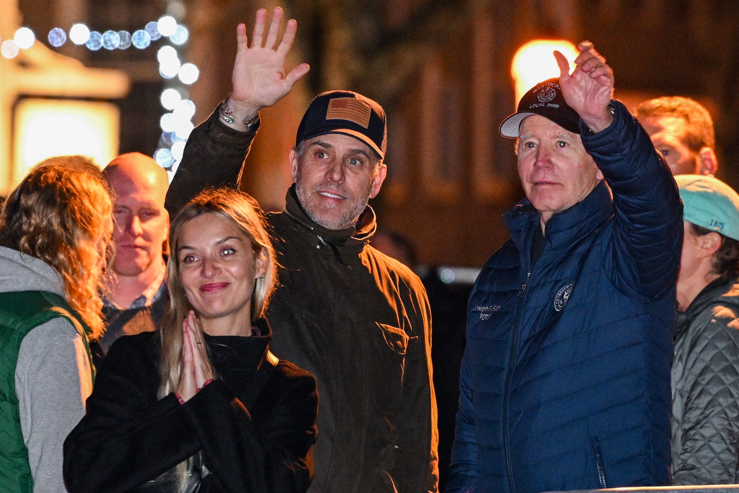 US President Joe Biden waves with his son Hunter Biden and his wife Melissa Cohen during a Christmas tree lighting ceremony in Nantucket, Massachusetts, on November 25, 2022. (Photo by Mandel NGAN / AFP) (Photo by MANDEL NGAN/AFP via Getty Images)
