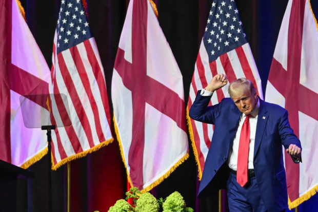 MONTGOMERY, ALABAMA - AUGUST 4: Former U.S. President Donald Trump dances on stage during the Alabama Republican Party’s 2023 Summer meeting at the Renaissance Montgomery Hotel on August 4, 2023 in Montgomery, Alabama. Trump's appearance in Alabama comes one day after he was arraigned on federal charges in Washington, D.C. for his alleged efforts to overturn the 2020 election. (Photo by Julie Bennett/Getty Images)