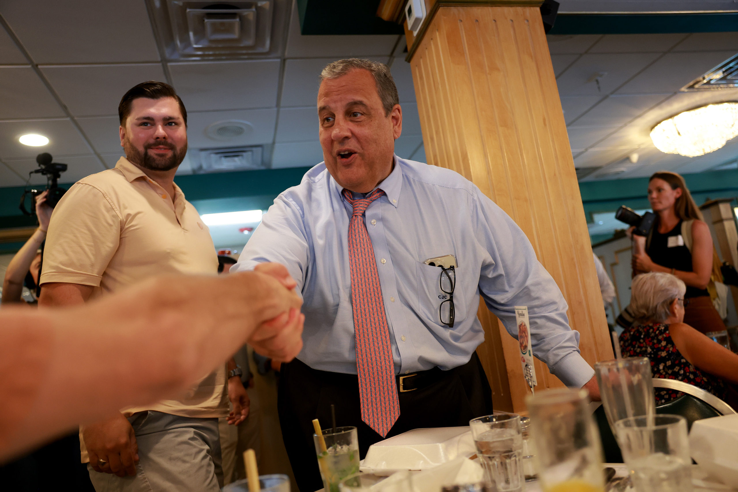 MIAMI, FLORIDA - AUGUST 18: Former New Jersey Gov. and Republican presidential candidate Chris Christie greets people during a campaign stop at the Versailles Restaurant on August 18, 2023 in Miami, Florida. (Joe Raedle/Getty Images)