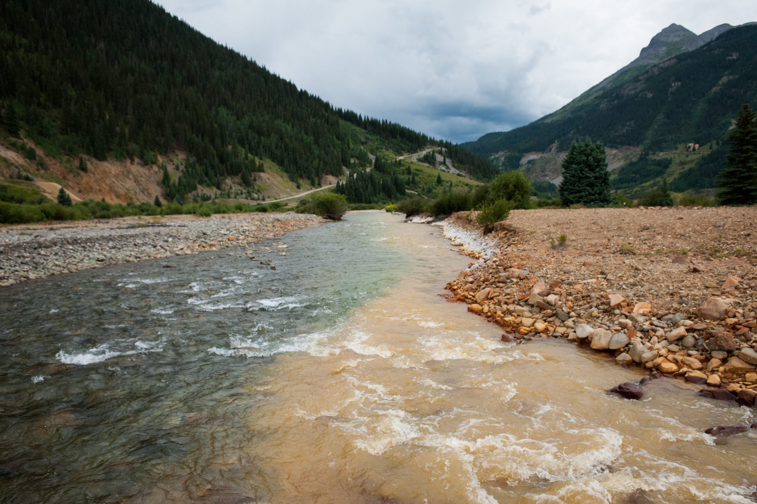 SILVERTON, CO - AUGUST 11: Cement Creek, which was flooded with millions of gallons of mining wastewater, meets with the Animas River on August 11, 2015 in Silverton, Colorado. The Environmental Protection Agency accidentally released approximately three million gallons of wastewater into the creek from the Gold King mine, polluting the larger Animas River downstream. (Photo by Theo Stroomer/Getty Images)