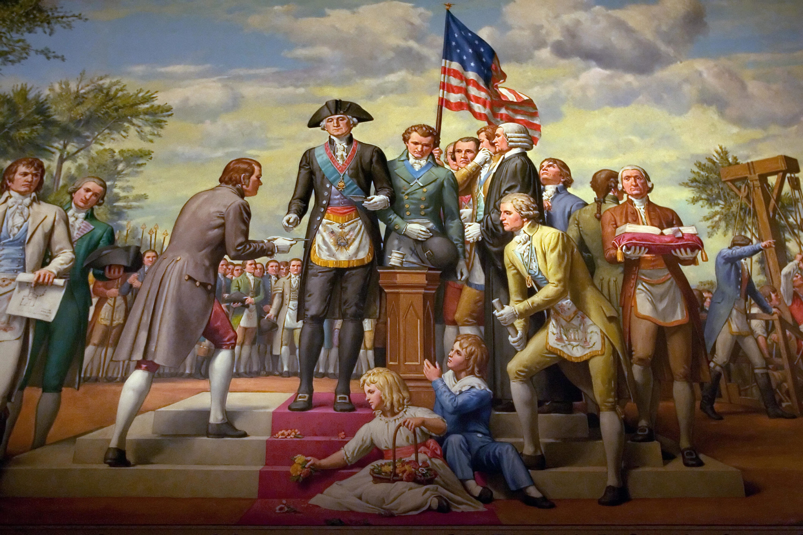 A mural depicts the first US President and a member of the Freemasons, George Washington, as he lays the cornerstone of the US Capitol on September 18, 1793, in Memorial Hall at the George Washington Masonic National Memorial in Alexandria, Virginia 20 November 2007. Washington is wearing full Masonic regalia. AFP PHOTO/SAUL LOEB (Photo credit should read SAUL LOEB/AFP via Getty Images)