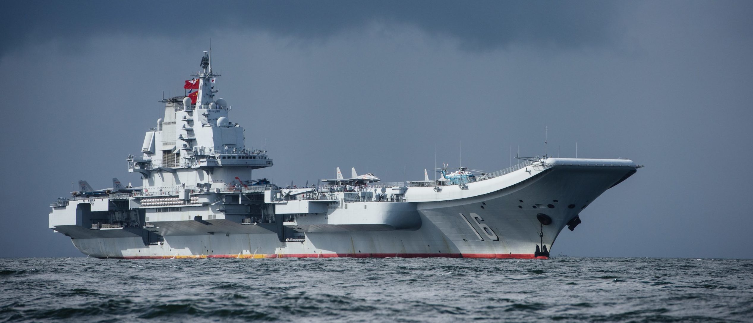 China's aircraft carrier Liaoning arriving in Hong Kong for the first time. (ANTHONY WALLACE/AFP via Getty Images)