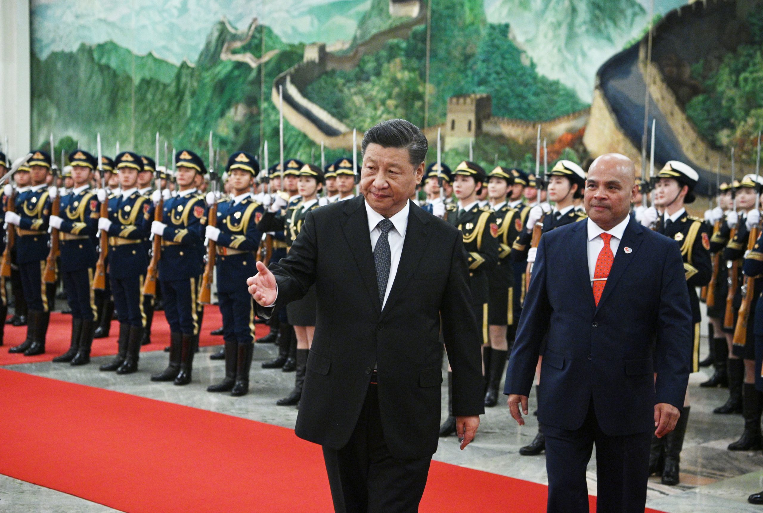 Chinas President Xi Jinping walks beside Micronesia's President David Panuelo (R) during a welcoming ceremony at the Great Hall of the People in Beijing on December 13, 2019. (Photo by Noel Celis / AFP)