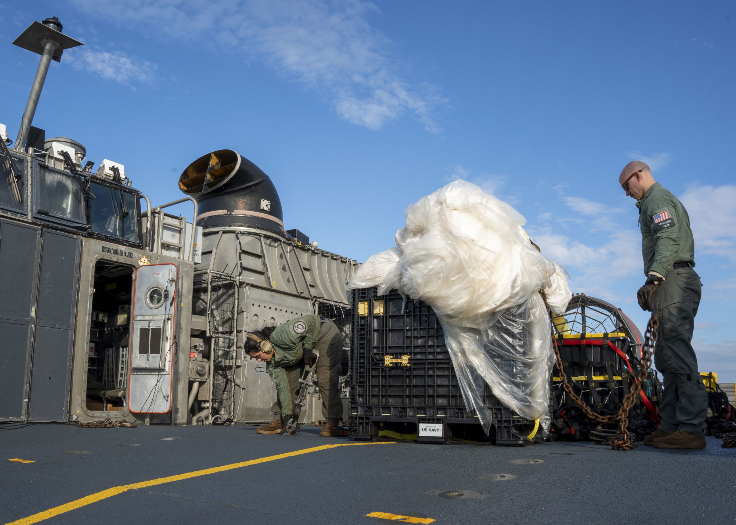 VIRGINIA BEACH, VA - FEBRUARY 10: In this U.S. Navy handout, Sailors assigned to Assault Craft Unit 4 prepare material recovered in the Atlantic Ocean from a high-altitude balloon for transport to federal agents at Joint Expeditionary Base Little Creek Feb. 10, 2023. At the direction of the President of the United States and with the full support of the Government of Canada, U.S. fighter aircraft under U.S. Northern Command authority engaged and brought down a high-altitude balloon within sovereign U.S. airspace and over U.S. territorial waters, Feb.4, 2023. Active duty, reserve, National Guard, and civilian personnel planned and executed the operation, and partners from the U.S. Coast Guard, Federal Aviation Administration, Federal Bureau of Investigation, and Naval Criminal Investigative Service (NCIS) ensured public safety throughout the operation and recovery efforts. 