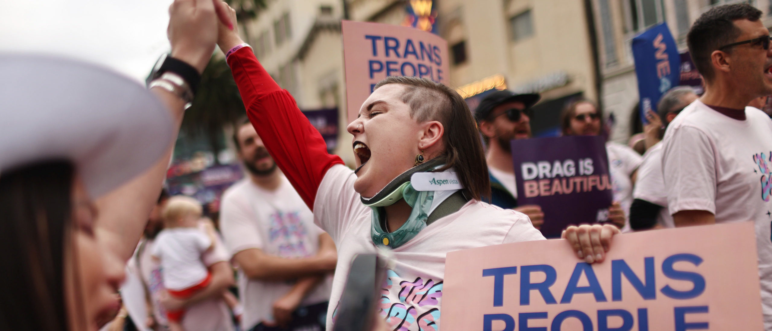 LOS ANGELES, CALIFORNIA - JUNE 11: ACLU march participants chant and hold signs in support of rights for transgender people and drag performers during the 2023 LA Pride Parade in Hollywood on June 11, 2023 in Los Angeles, California. (Photo by Mario Tama/Getty Images)