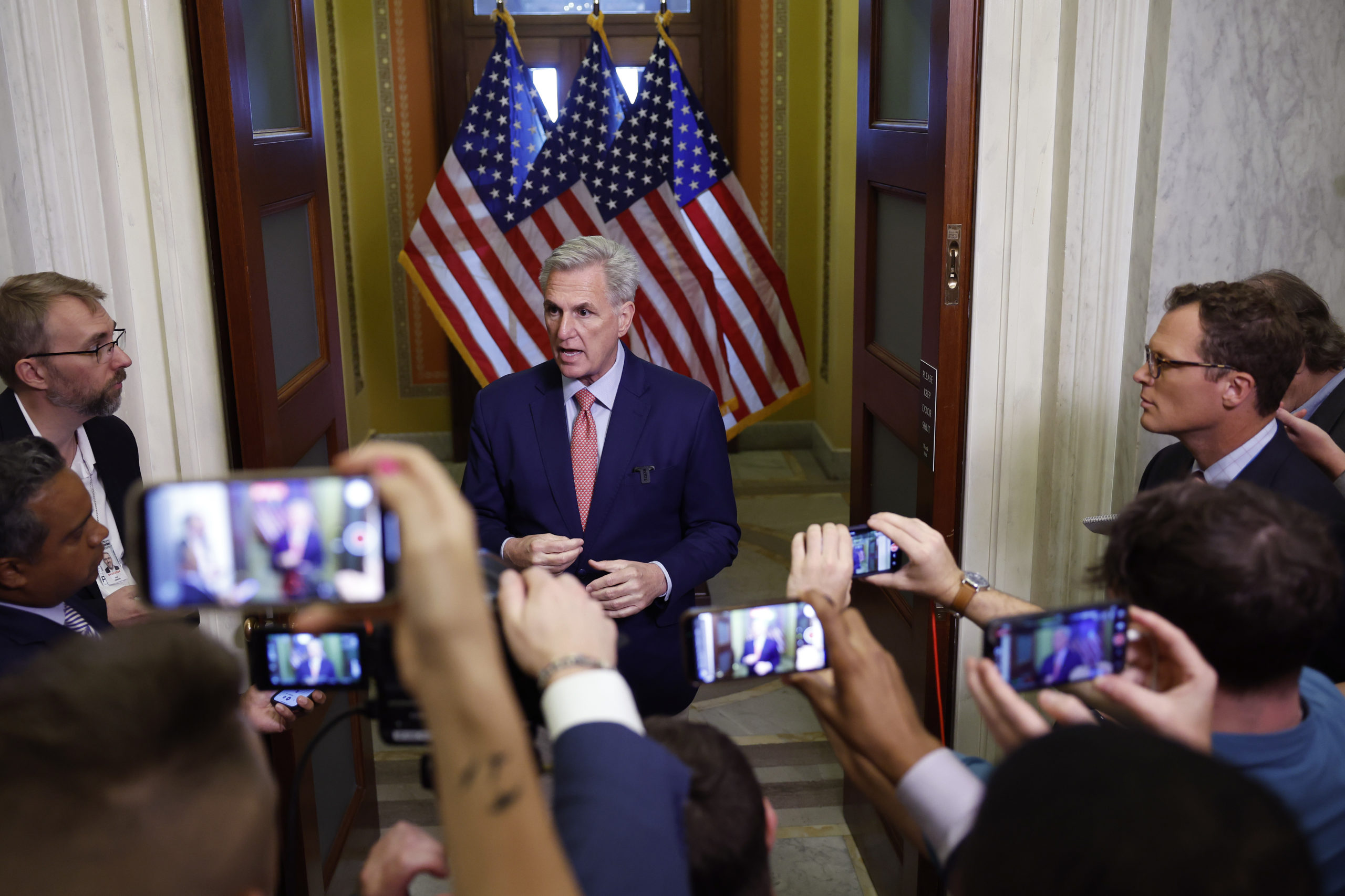 Reporters use their cell phones to film U.S. Speaker of the House Kevin McCarthy (R-CA) speaking outside the Speakers Balcony at the U.S. Capitol Building on July 25, 2023 in Washington, DC. McCarthy held the media availability with reporters to discuss a potential impeachment inquiry against U.S. President Joe Biden that would focus on the Biden family's alleged financial misconduct. (Photo by Anna Moneymaker/Getty Images)