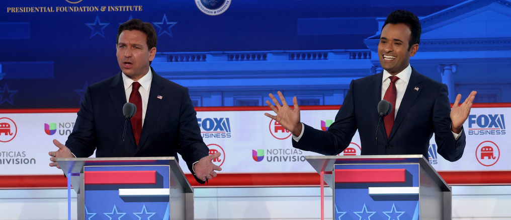 SIMI VALLEY, CALIFORNIA - SEPTEMBER 27: Republican presidential candidates (L-R), Florida Gov. Ron DeSantis and Vivek Ramaswamy participate in the FOX Business Republican Primary Debate at the Ronald Reagan Presidential Library on September 27, 2023 in Simi Valley, California. Seven presidential hopefuls squared off in the second Republican primary debate as former U.S. President Donald Trump, currently facing indictments in four locations, declined again to participate. (Photo by Justin Sullivan/Getty Images)