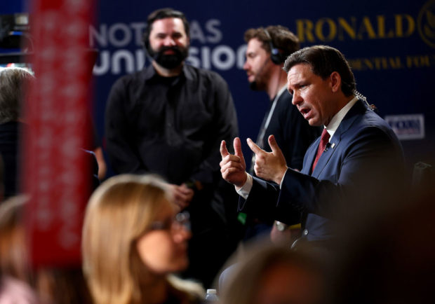 SIMI VALLEY, CALIFORNIA - SEPTEMBER 27: Republican presidential candidate Florida Gov. Ron DeSantis talks to reporters in the spin room at the FOX Business Republican Primary Debate at the Ronald Reagan Presidential Library on September 27, 2023 in Simi Valley, California. Seven presidential hopefuls squared off in the second Republican primary debate as former U.S. President Donald Trump, currently facing indictments in four locations, declined again to participate. (Photo by Mario Tama/Getty Images)