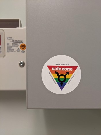 An LGBT sticker in an exam room at the office of the author's former pediatrician. (Photo by Nicole Solas)