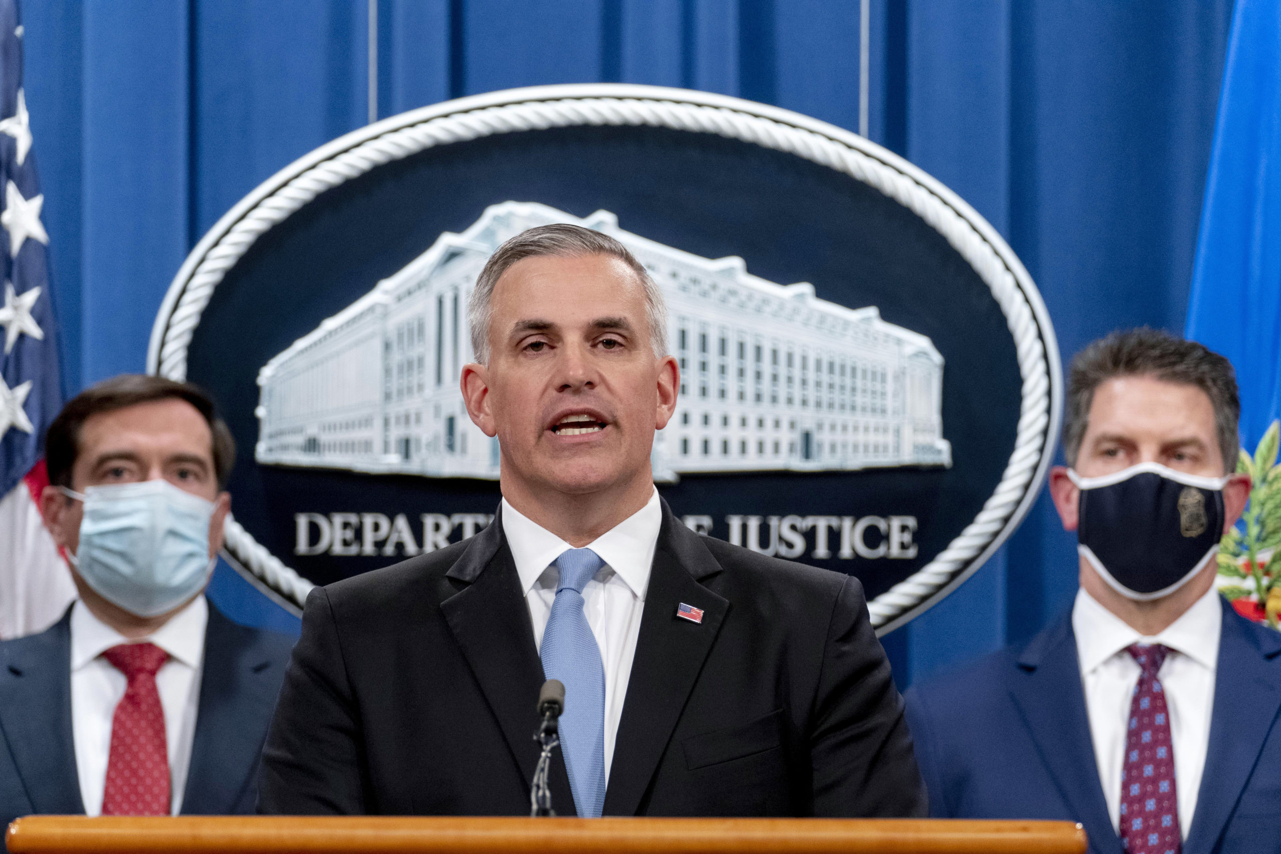 WASHINGTON, DC - OCTOBER 19: U.S. Attorney for the Western District of Pennsylvania Scott Brady, center, accompanied by Assistant Attorney General for the National Security Division John Demers, left, and FBI Deputy Director David Bowdich right, speaks at a news conference at the Department of Justice, on October 19, 2020 in Washington, DC. The Justice Department announced an indictment against six Russia GRU officers charged with engaging in a series of hacking and malware deployment operations to attack other countries' infrastructure, elections and other actions designed to further Russia's interests. (Photo by Andrew Harnik - Pool/Getty Images)