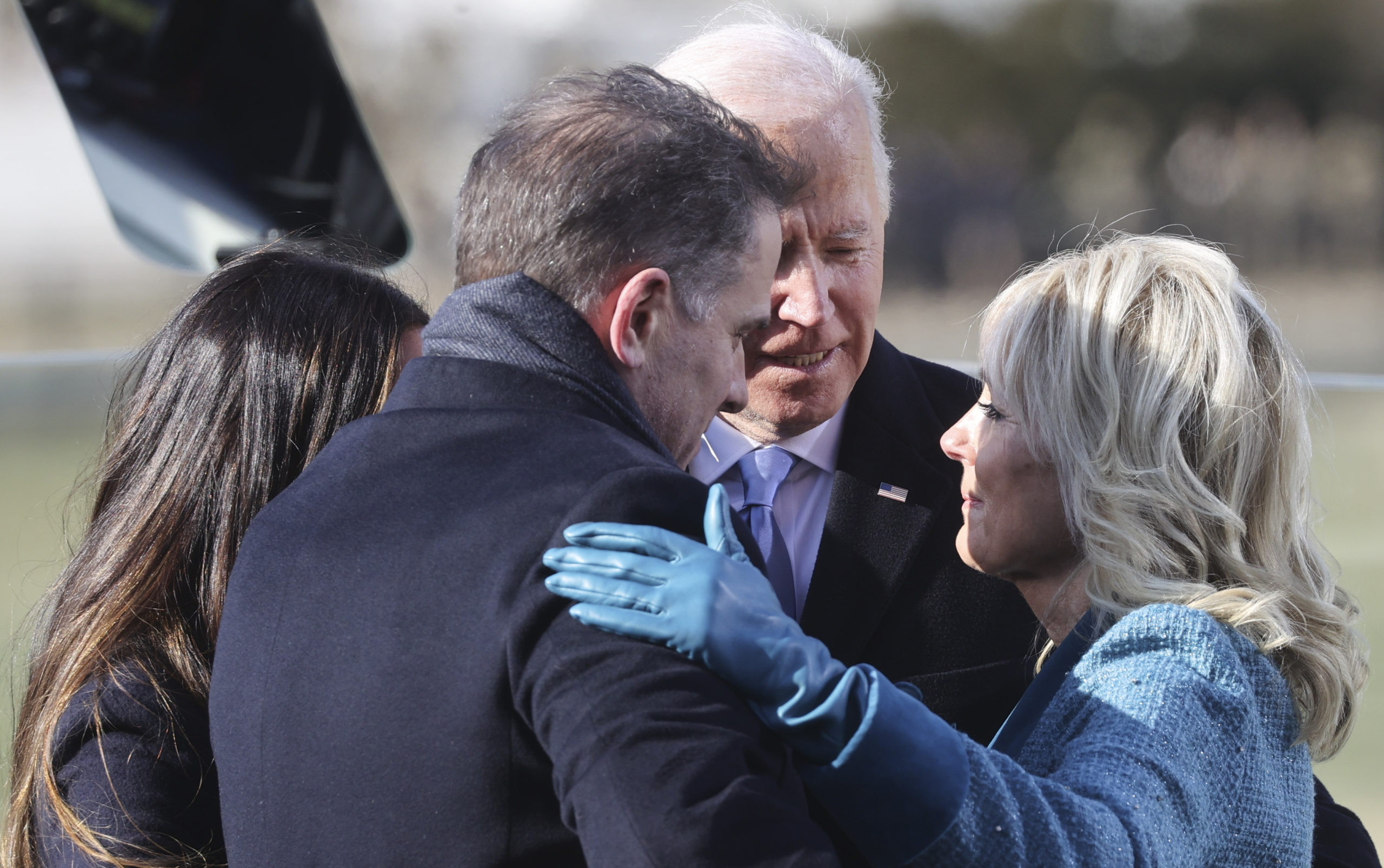 WASHINGTON, DC - JANUARY 20: U.S. President Joe Biden embraces his family after he was sworn in as the 46th President of the United States during his inauguration on the West Front of the U.S. Capitol on January 20, 2021 in Washington, DC. During today's inauguration ceremony Biden becomes the 46th president of the United States. (Photo by Jonathan Ernst-Pool/Getty Images)
