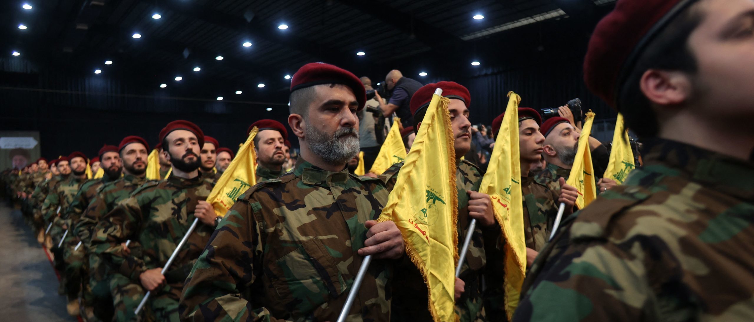 Hezbollah militants, parade in Beirut's southern suburbs on April 14, 2023. 