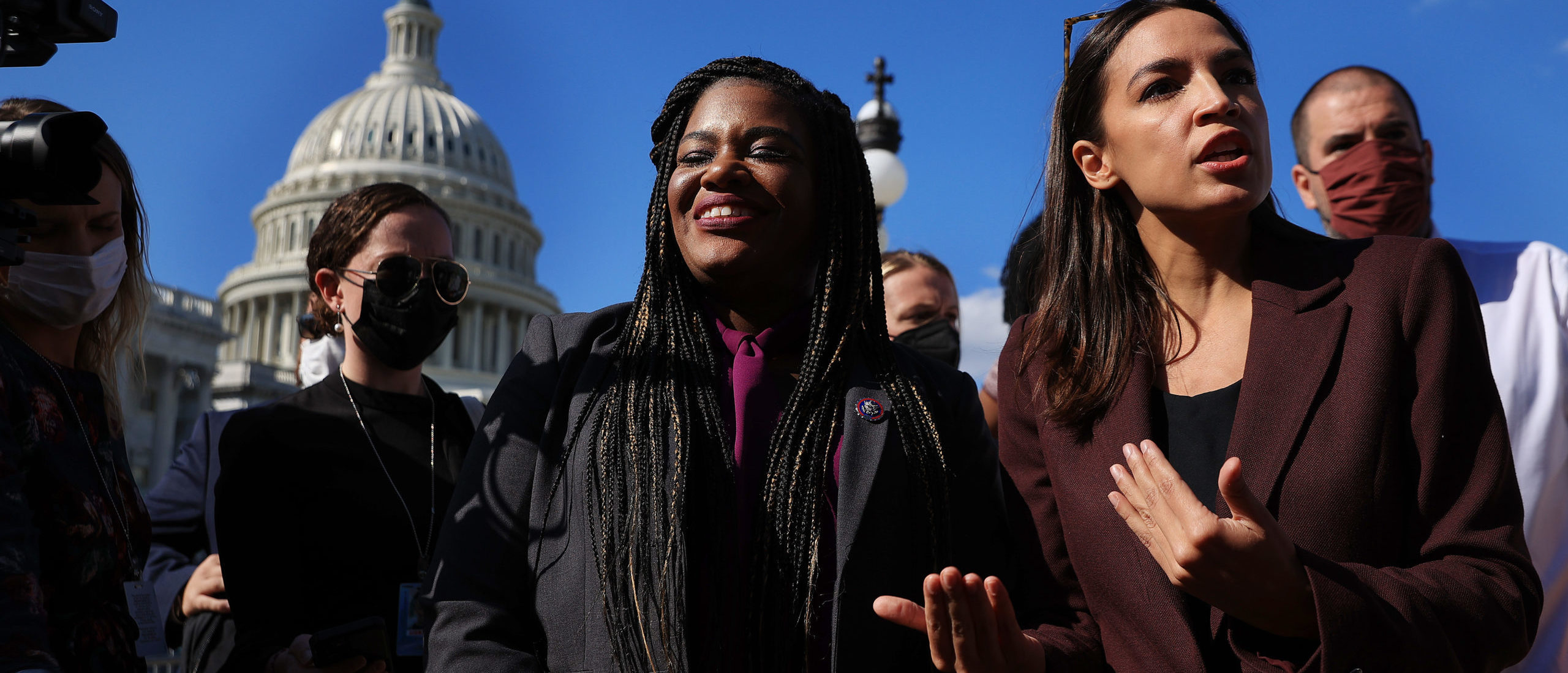 WASHINGTON, DC - SEPTEMBER 30: Congressional Progressive Caucus members Rep. Cori Bush (D-GA) and Rep. Alexandria Ocasio-Cortez (D-NY) talk to reporters before a vote to keep the federal government open until early December outside the U.S. Capitol on September 30, 2021 in Washington, DC. (Photo by Chip Somodevilla/Getty Images)
