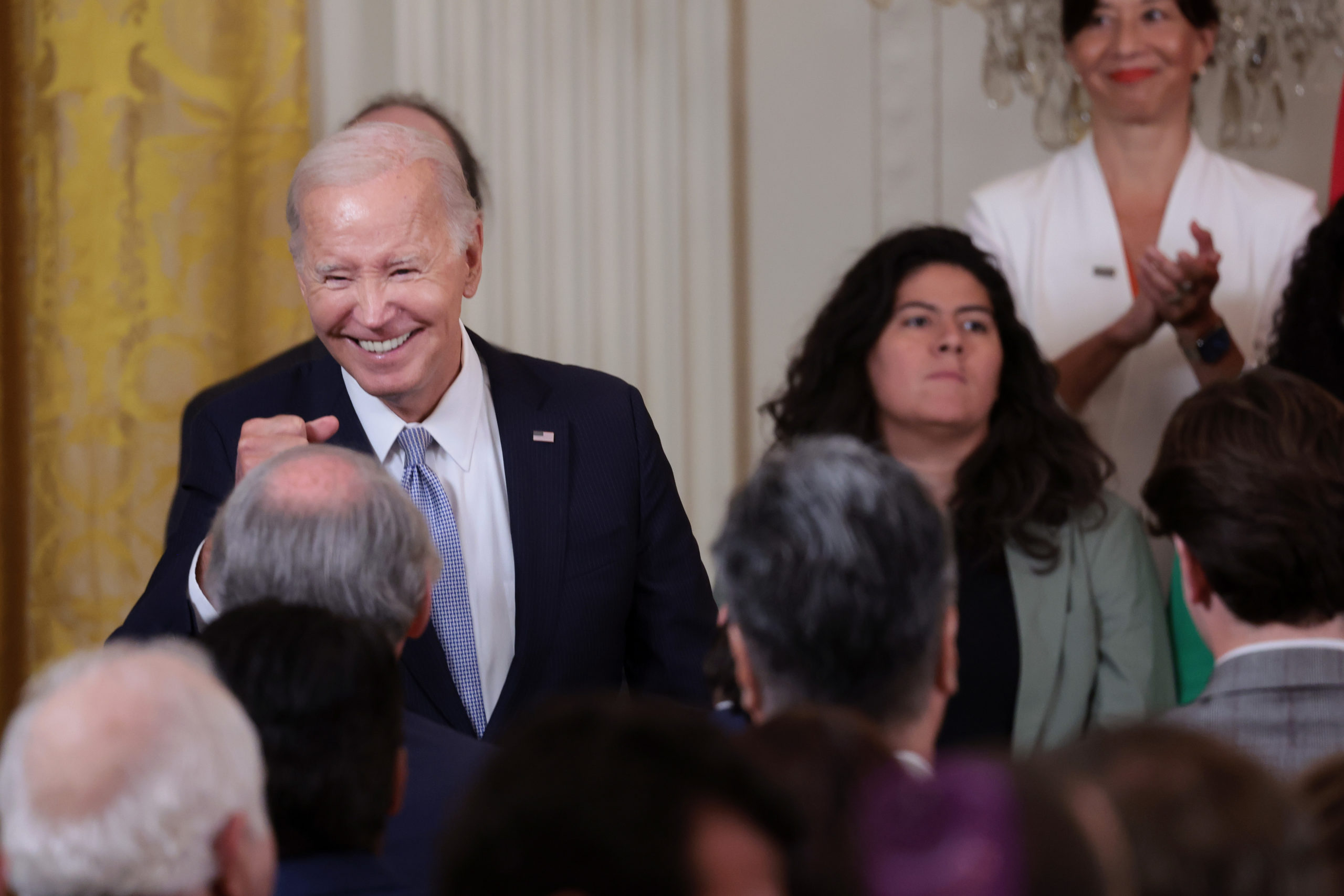 WASHINGTON, DC - AUGUST 16: U.S. President Joe Biden greets audience members during an event recognizing the first anniversary of the Inflation Reduction Act in the East Room at the White House on August 16, 2023 in Washington, DC. The Inflation Reduction Act aims to curb inflation by reducing the federal government budget deficit, lowering prescription drug prices, and investing into clean domestic energy programs. (Photo by Win McNamee/Getty Images)