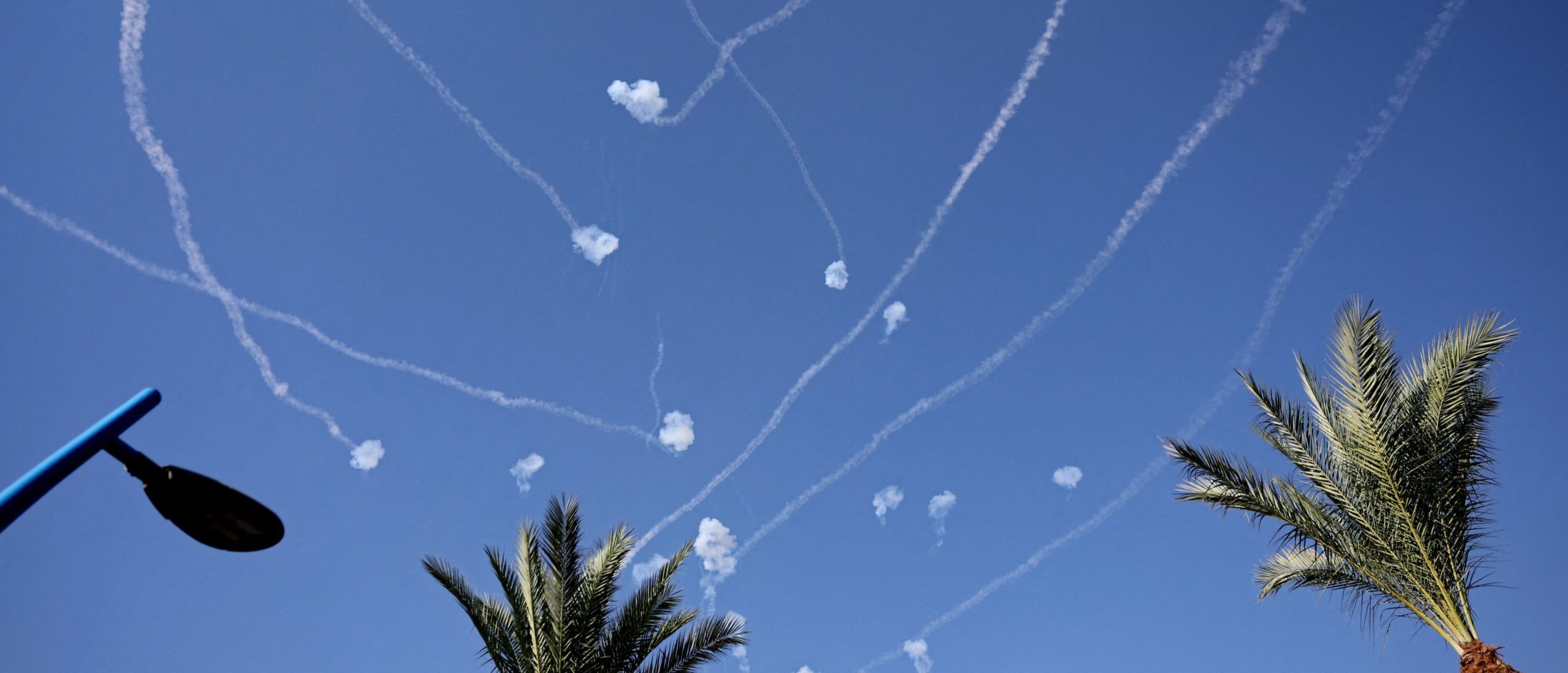 Graphic content / A picture taken from the Israeli city of Sderot shows rockets fired from the Gaza Strip intercepted by Israel's Iron Dome defence missile system on October 14, 2023, amid the ongoing battles between Israel and the Palestinian Islamist group Hamas. (Photo by THOMAS COEX/AFP via Getty Images)