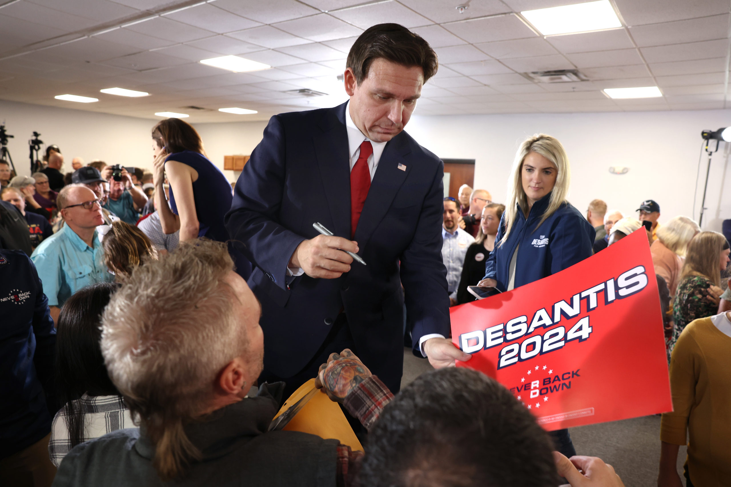Republican presidential candidate Florida Governor Ron DeSantis greets guests during a campaign event at Refuge City Church on October 08, 2023 in Cedar Rapids, Iowa. DeSantis said Israel can and should defend themselves against the "Hamas terrorists" during the event and said that he, unlike his adversary Republican presidential candidate former President Donald Trump, has a plan to make Mexico pay for building a border wall. (Photo by Scott Olson/Getty Images)