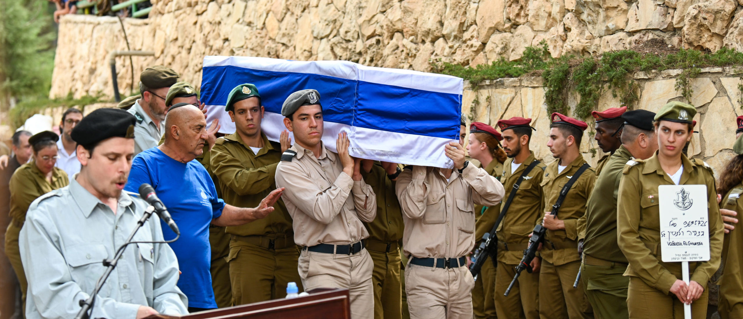 JERUSALEM, ISRAEL - OCTOBER 12: Soldiers carry the casket of Valentin (Eli) Ghnassia, 23, who was killed in a battle with Hamas militants at Kibbutz Be’eeri near the Israeli border with the Gaza Strip during his funeral on October 12, 2023 at Mount Herzl Military Cemetery in Jerusalem, Israel. Israel has sealed off Gaza and launched sustained retaliatory air strikes, which have killed at least 1,200 people with more than 300, 000 displaced, after a large-scale attack by Hamas. On October 7, the Palestinian militant group Hamas launched a surprise attack on Israel from Gaza by land, sea, and air, killing over 1,200 people and wounding around 2800. Israeli soldiers and civilians have also been taken hostage by Hamas and moved into Gaza. The attack prompted a declaration of war by Israeli Prime Minister Benjamin Netanyahu and the announcement of an emergency wartime government.
