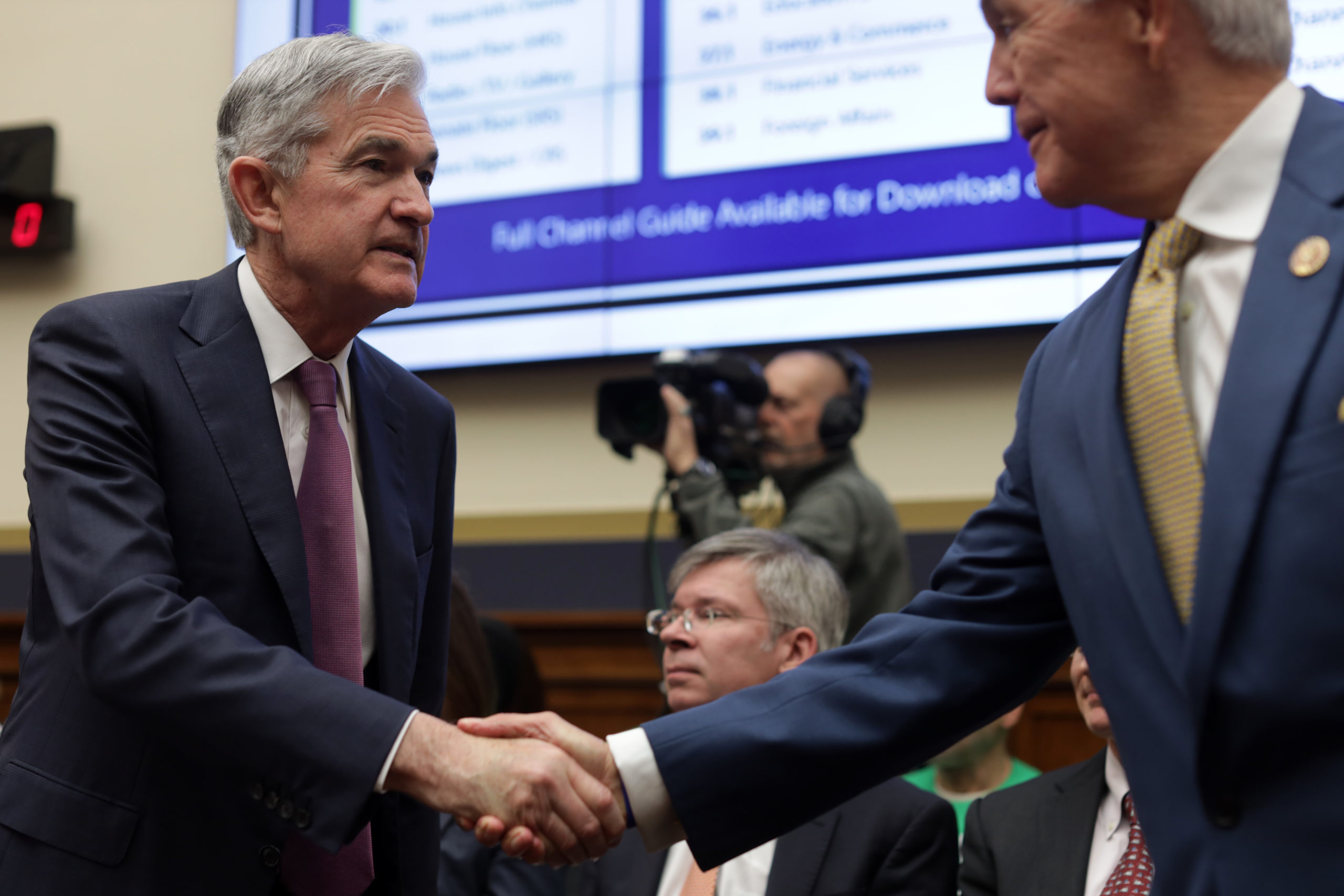 Federal Reserve Board Chairman Jerome Powell shakes hands with U.S. Rep. Roger Williams (R-TX) prior to a hearing before House Financial Services Committee February 11, 2020 on Capitol Hill in Washington, DC. The committee held a hearing on "Monetary Policy and the State of the Economy." (Photo by Alex Wong/Getty Images)