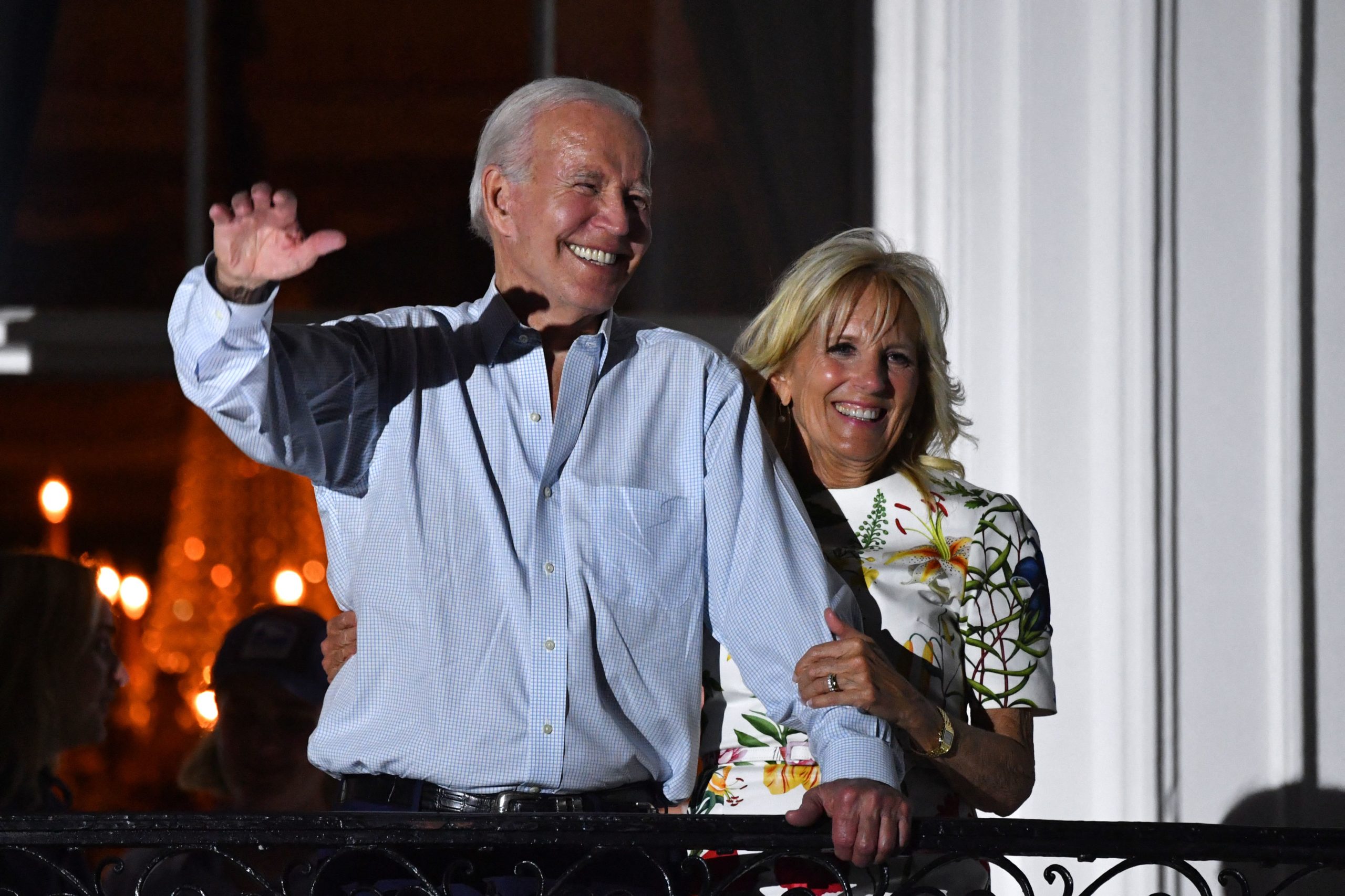 US President Joe Biden (L) and US First Lady Jill Biden wave from a balcony of the White House during 4th of July fireworks in Washington, DC, July 4, 2022. (Photo by Nicholas Kamm / AFP) (Photo by NICHOLAS KAMM/AFP via Getty Images)