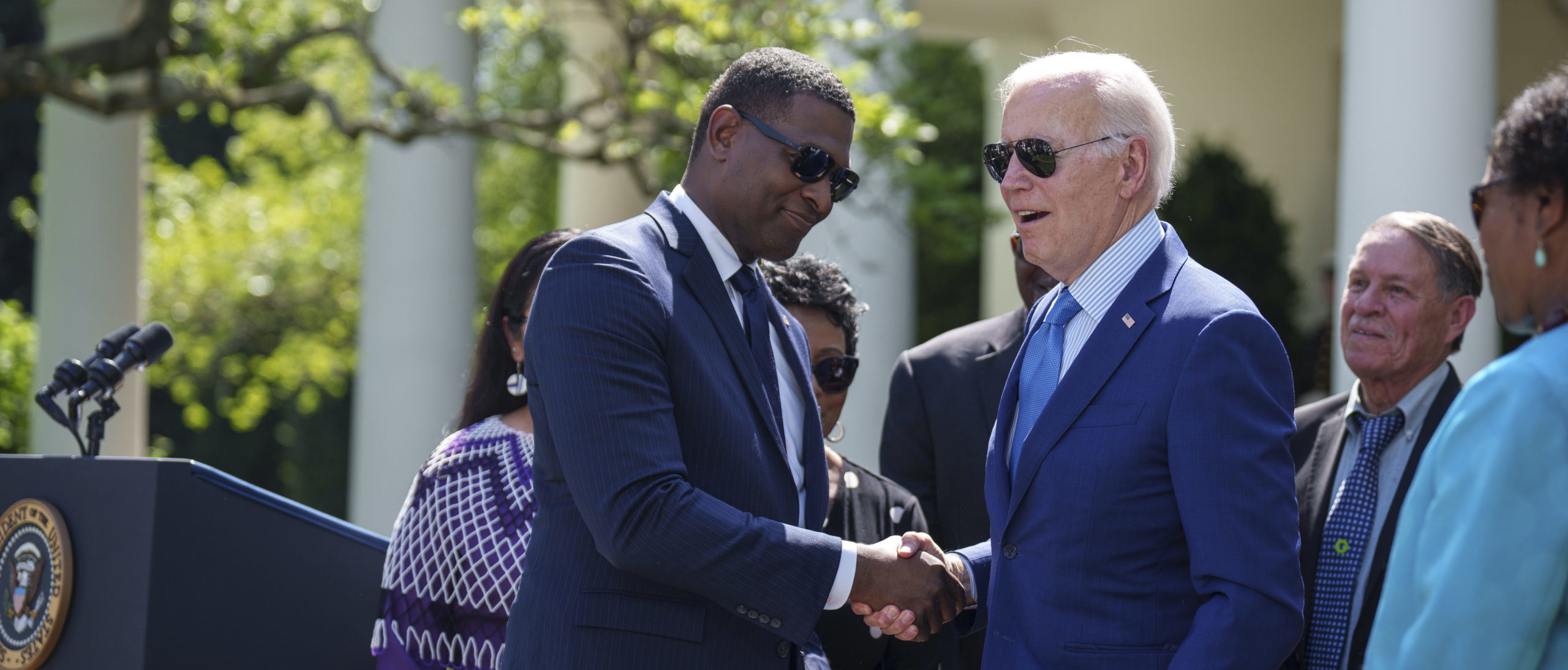 President Joe Biden shakes hands with EPA Administrator Michael Regan after signing an executive order that would create the White House Office of Environmental Justice, in the Rose Garden of the White House April 21, 2023 in Washington, D.C. 